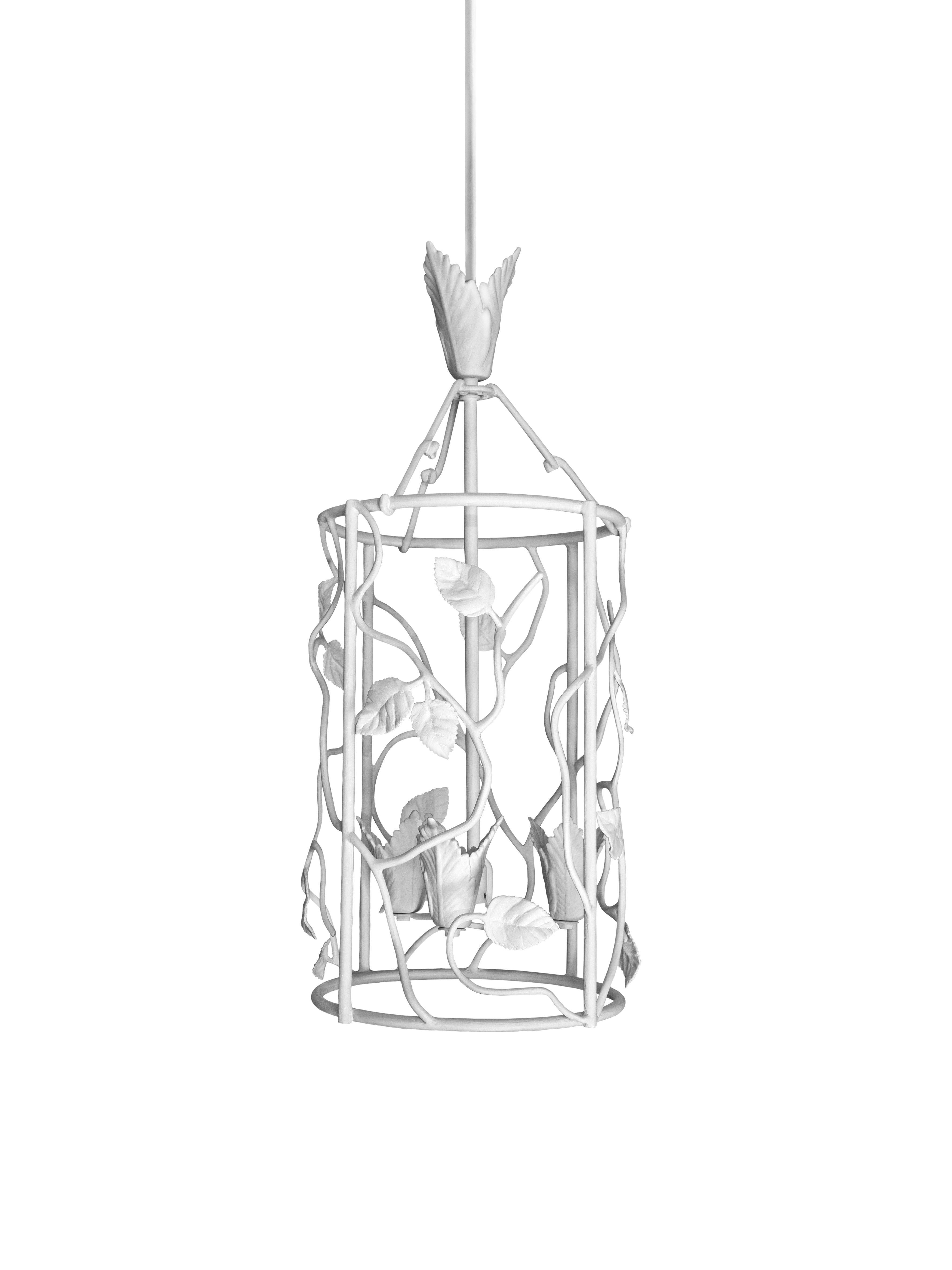 With rose leaves interspersed on a textured frame, this lantern resembles a piece of naturalistic sculpture. Hand sculpted plaster on metal armature. The metal armature is reinforced with plaster bandages for durability before being sculpted by