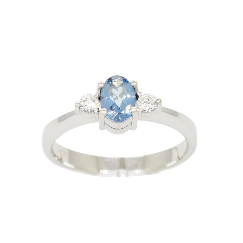 Small aquamarine and diamond ring custom made in solid 18K white gold with 0.38 carats stunning oval shape natural aquamarine in the middle of 2 brilliant cut diamonds in 0.12 carats total weight. This is a timeless ring design with prongs on each
