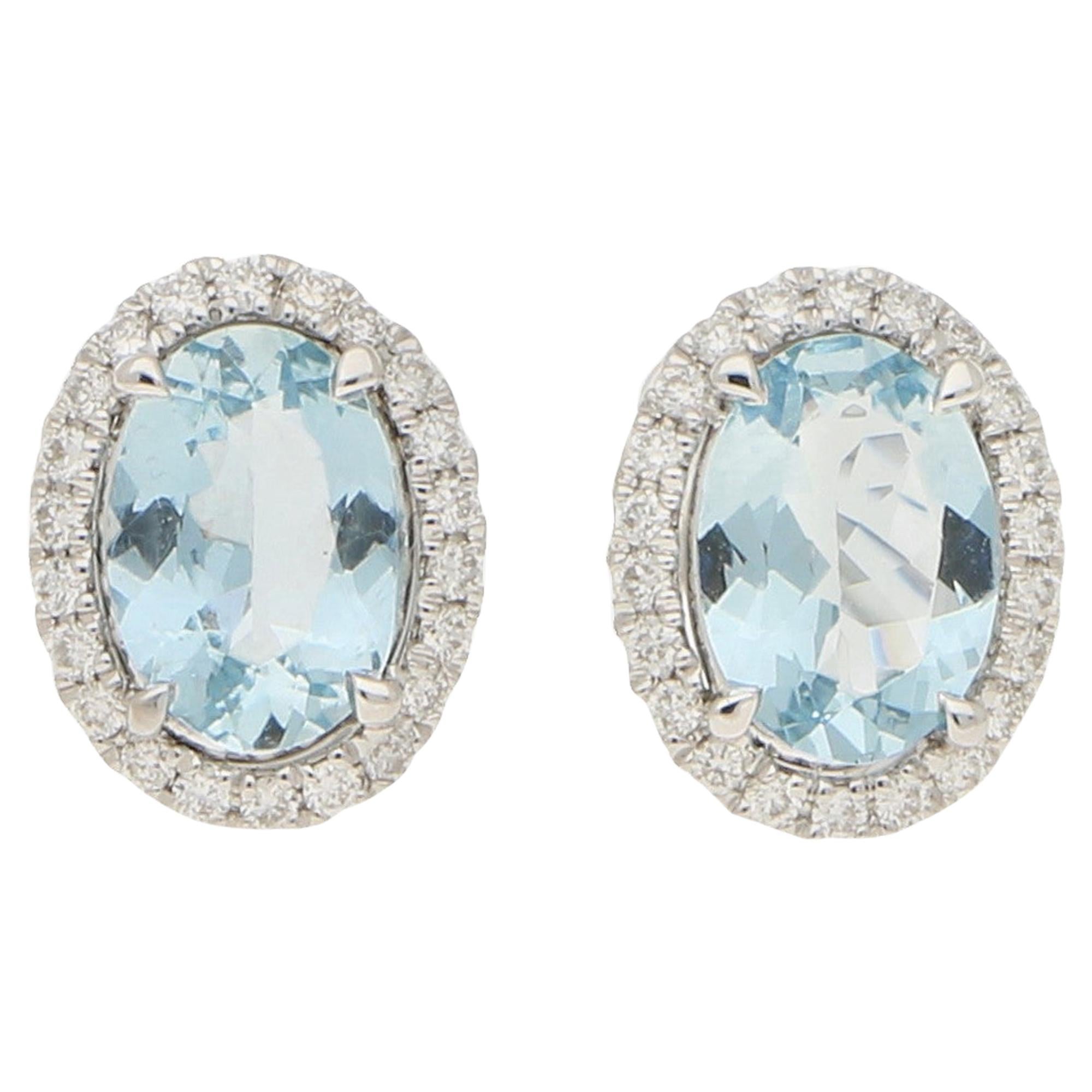 Small Aquamarine and Diamond Halo Stud Earrings Set in 18 Karat White Gold