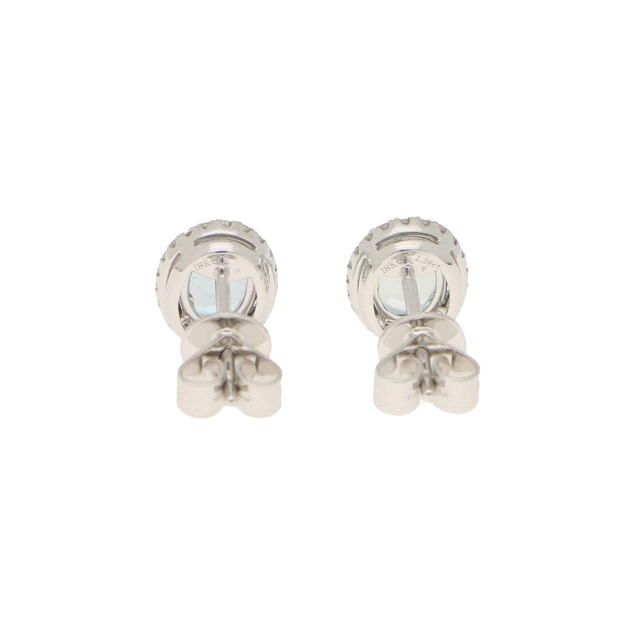 Modern Small Aquamarine and Diamond Halo Stud Earrings Set in 18 Karat White Gold