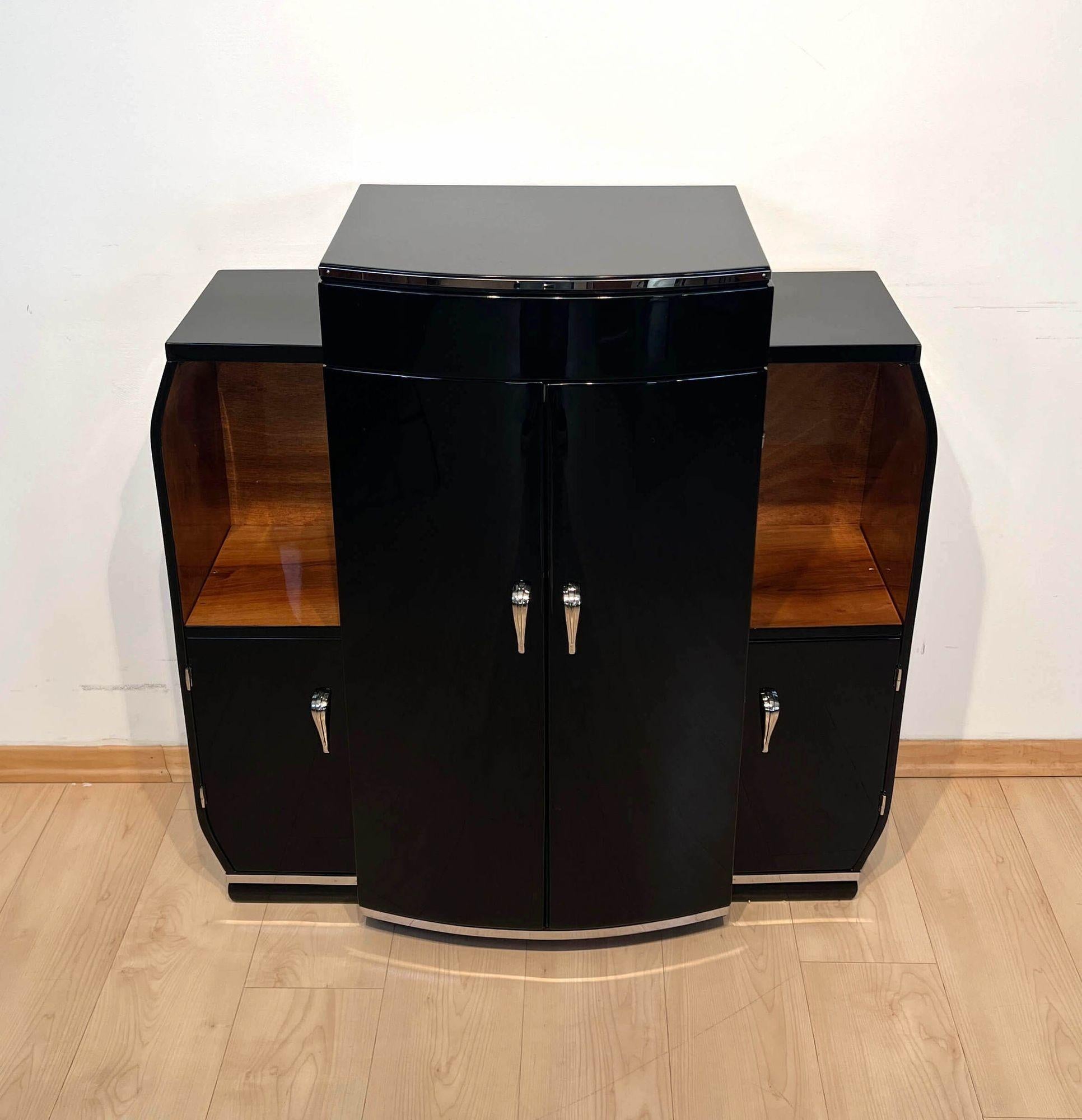 Small original Art Deco bar cabinet or Dry Bar from France about 1930
 
Walnut wood, on the outside, high-gloss black lacquered with piano lacquer.
2 large and 2 small doors. Free compartments and interior in walnut veneer, clear