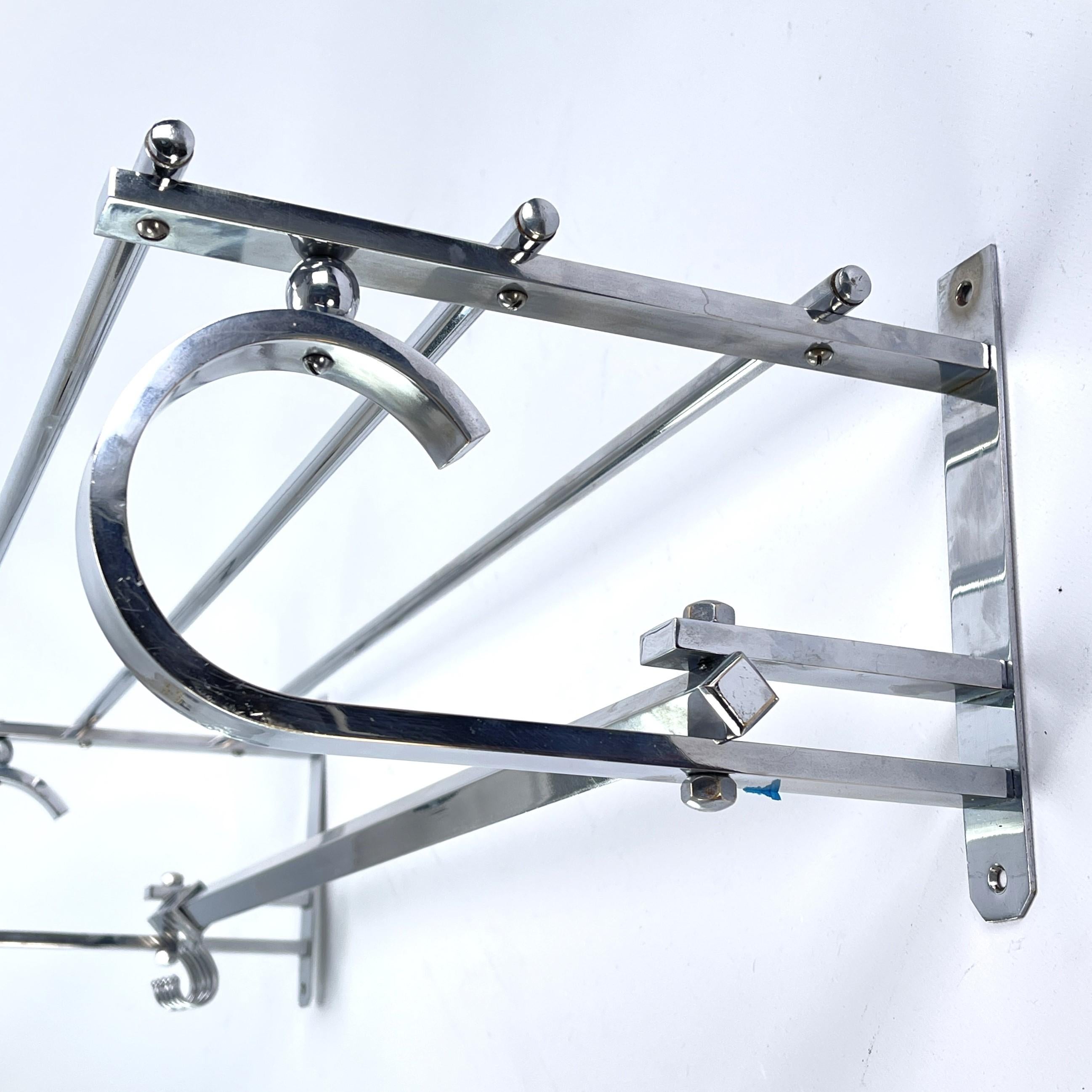 Art Deco wardrobe chrome - 1930s

This beautiful French wall coat rack from the 1930s is in the streamline modern Art Deco style. This style emphasized curvy streamlined shapes. This is a beautiful, timeless and antique piece that will leave a