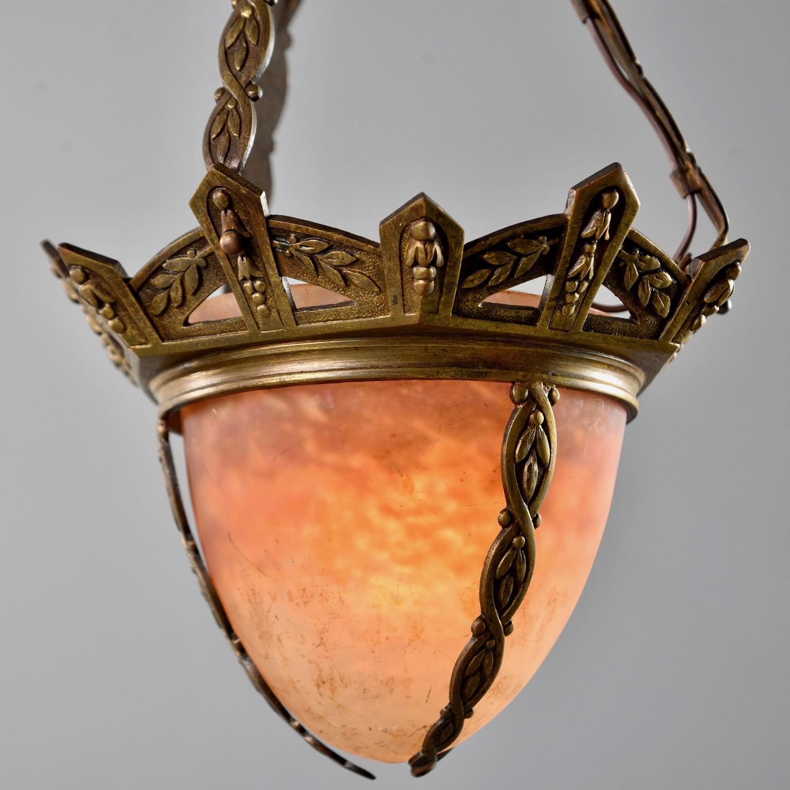 Small hanging fixture has bronze frame and decorative chain with Muller glass globe, circa 1930s. Original canopy included. Single standard sized socket. New wiring for US electrical standards.