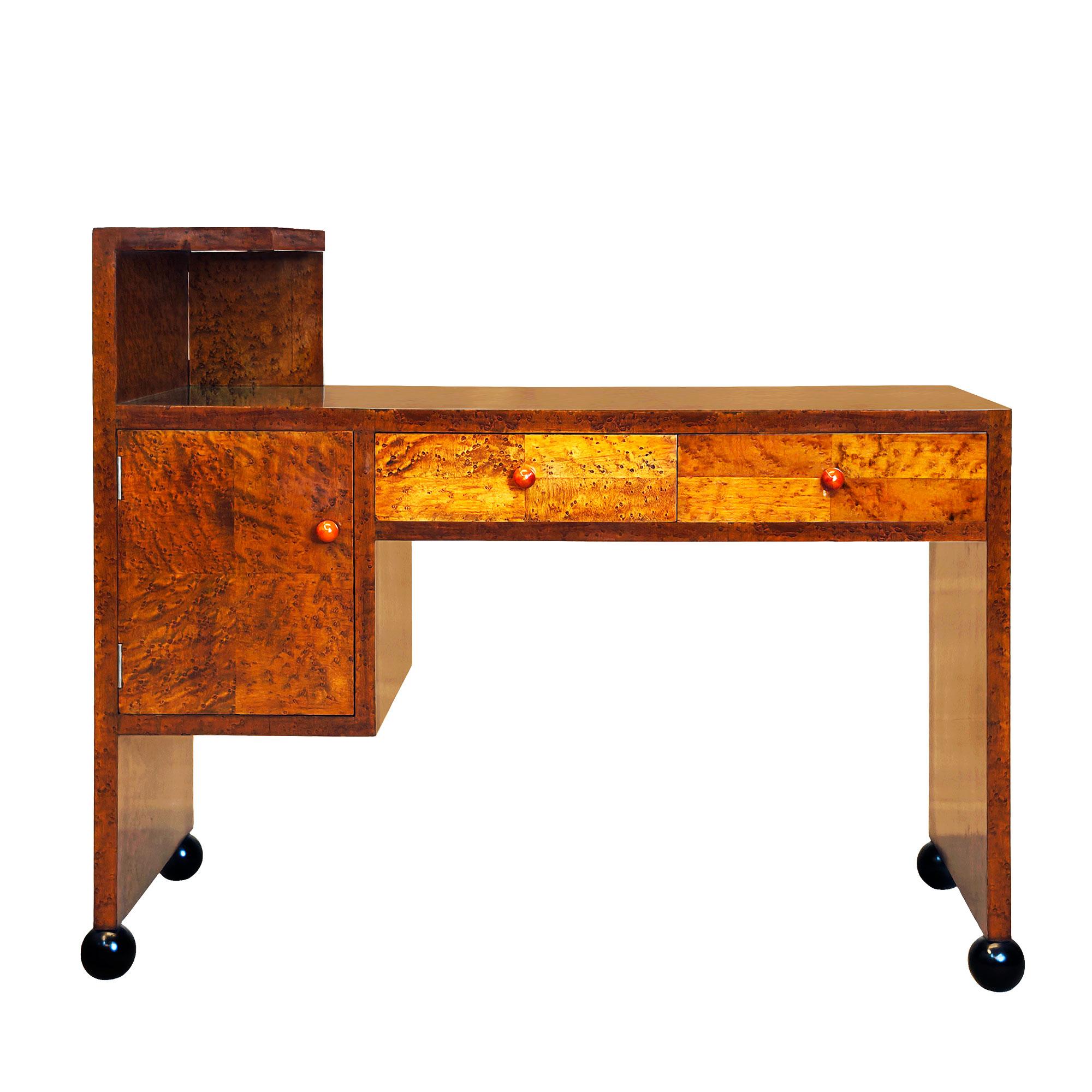 Small Art Deco console or low dressing table, bird’s eye maple veneer, door and drawers with marquetry of the same wood. Four black ball feet, coral bakelite pull knobs. French polish.

Spain, Barcelona circa 1930

Dimensions
cm 100 / 103 (with