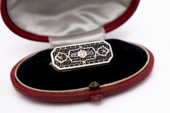 Small Art Deco gold brooch with sapphires, mid-20th century.