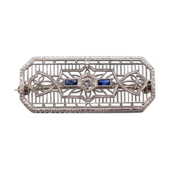 Small Art Deco gold brooch with sapphires, mid-20th century.