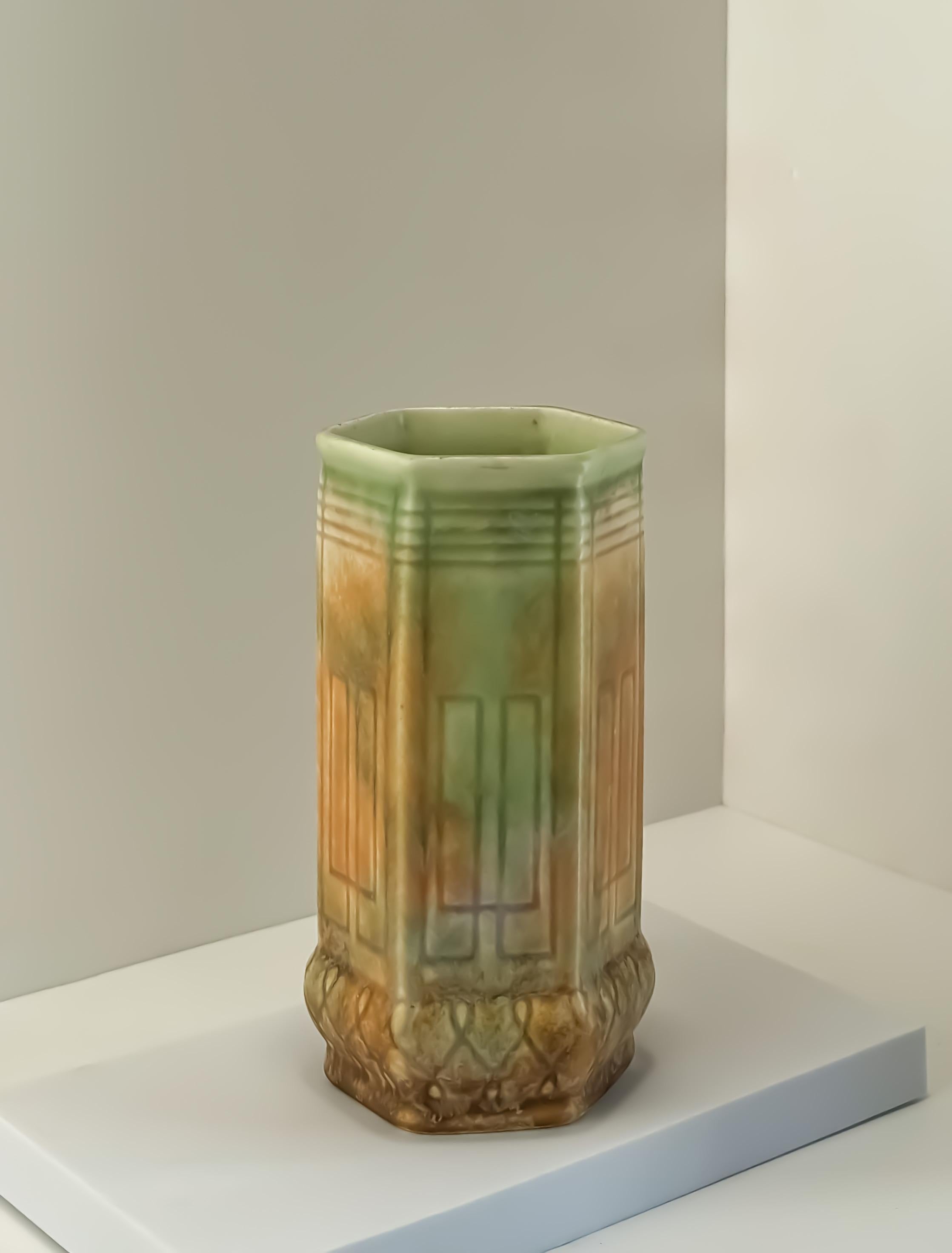 An Art Deco hexagonal orange and green ceramic drip-ware vase. Crafted in the 1930s by Beswick England 


A modernist interpretation of a gothic ecclesiastical pillar: a hexagonal-shaped body bulging outwards towards its base. Each of the six panels