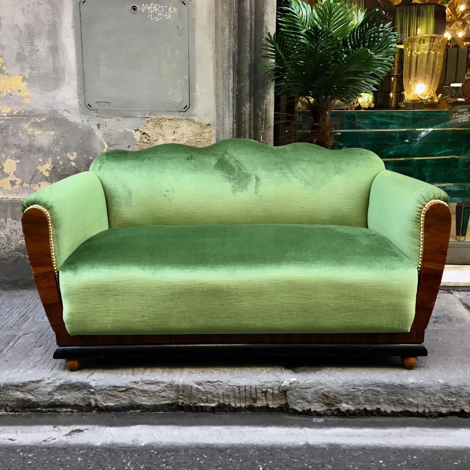 Small Art Deco sofa, the sides are made in a fine briar root wood. We have reupholstered with acid green velvet. Only light conservative Restoration of the wooden part has been done. This sofa is able to fit both an entrance or a living room with a