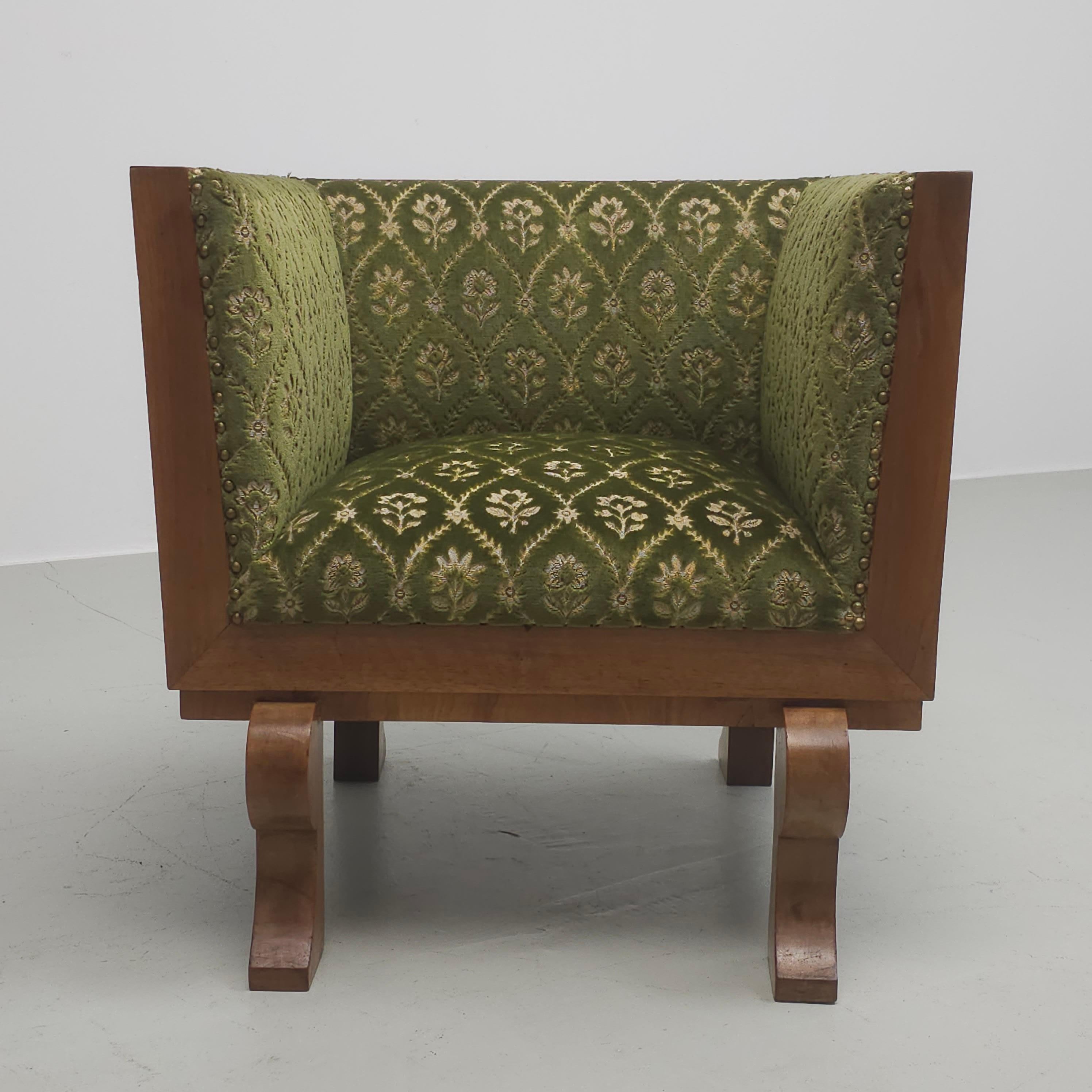 Very decorative, Art Deco style little club chair. Walnut veneer and original green velvet upholstery. Possible French or Italian design but no visible proof for that
On the bottom it's signed with number 34.

The back of the chair is wider then the