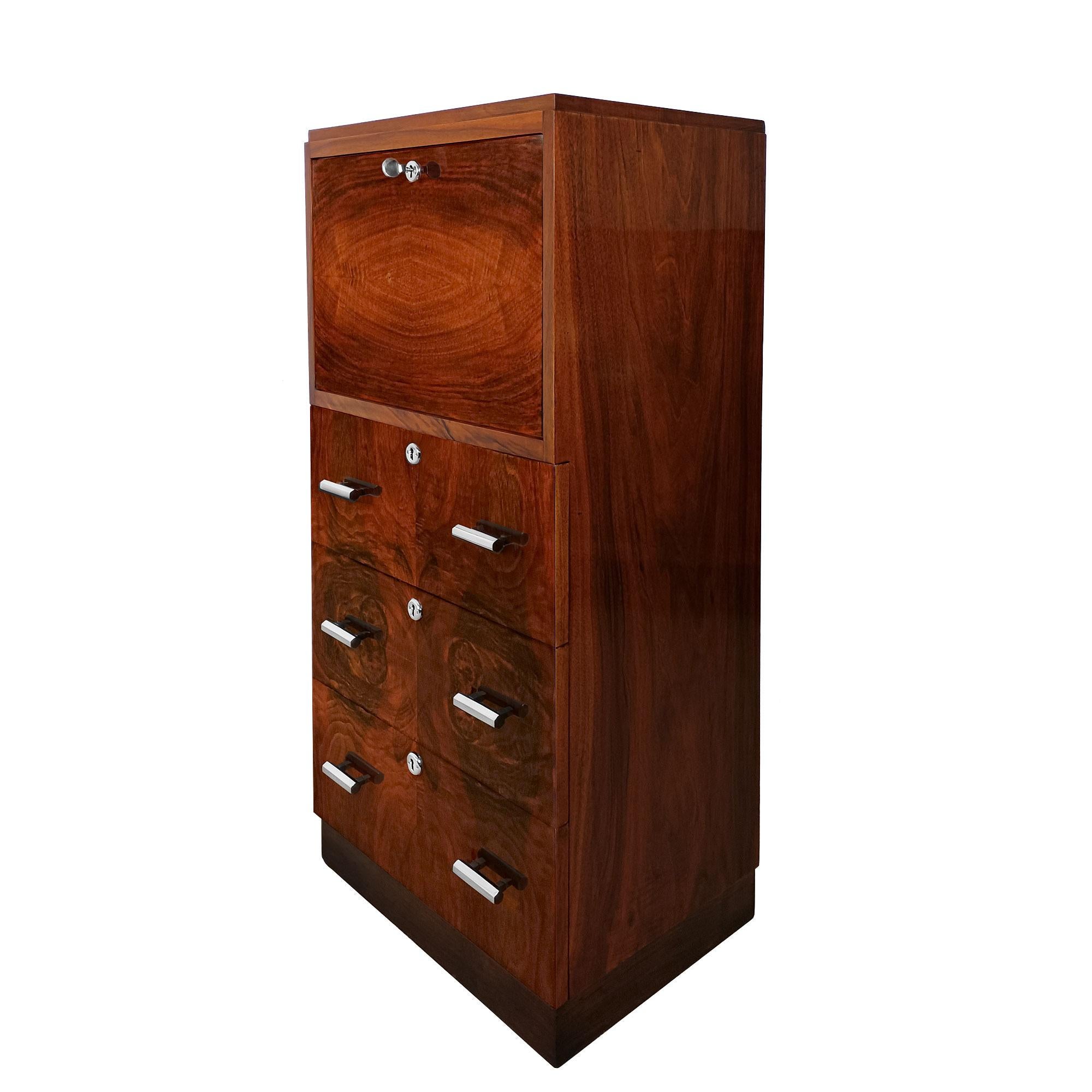 Small Art Deco writing desk with walnut and burr walnut veneer, three drawers and a flap door opening onto a small desk and storage area in marquetry and light walnut. Very good quality of workmanship. French polish,
France circa