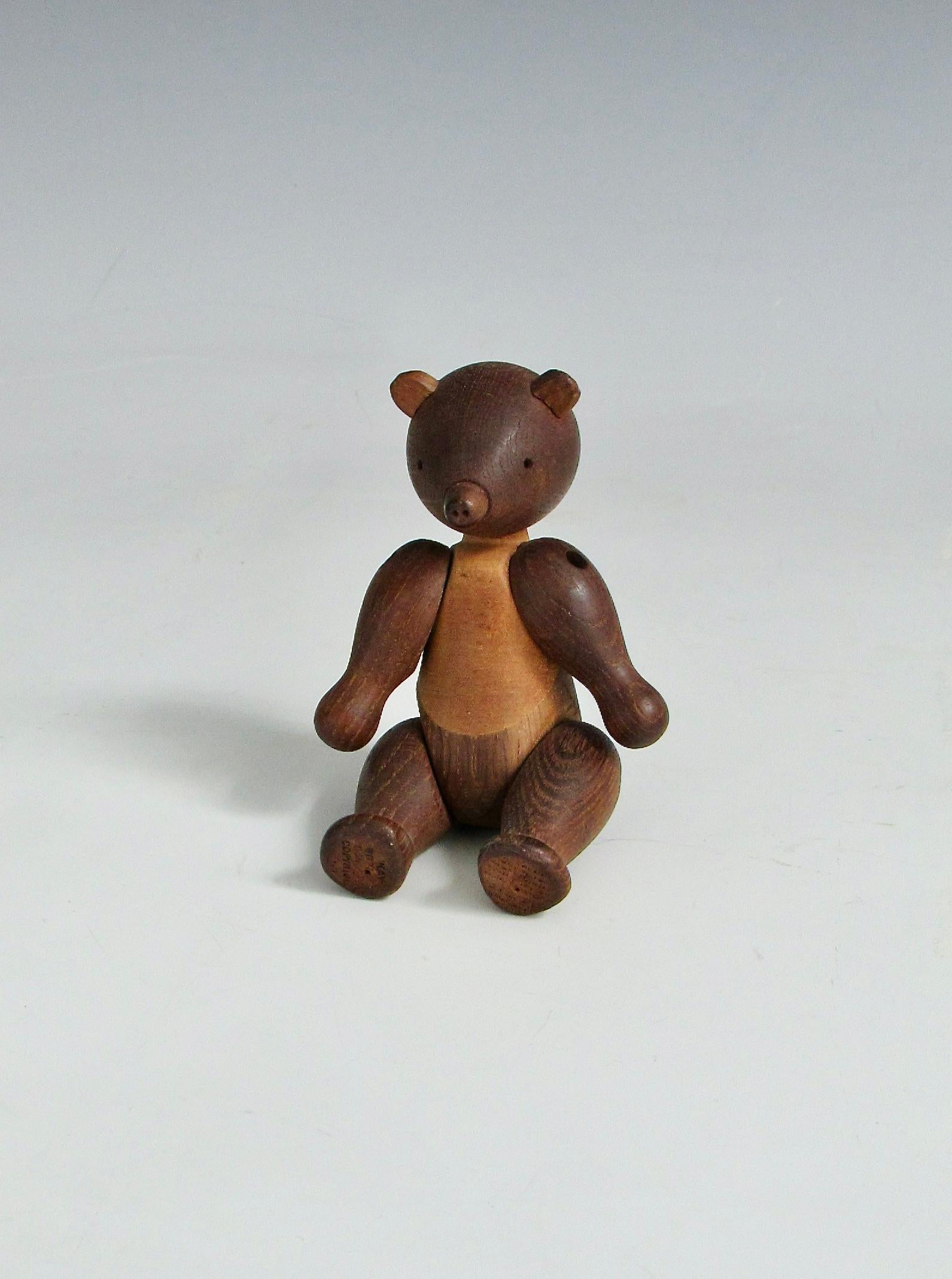  Kay Bojesen wooden bear from the early 1950s in teak . Stamped Kay Bojeson Denmark Copyright . 
 Kay Bojesen from the start in 1932 hand made animal figure toys in his small Copenhagen workshop .  
 This marked the start of a story about a