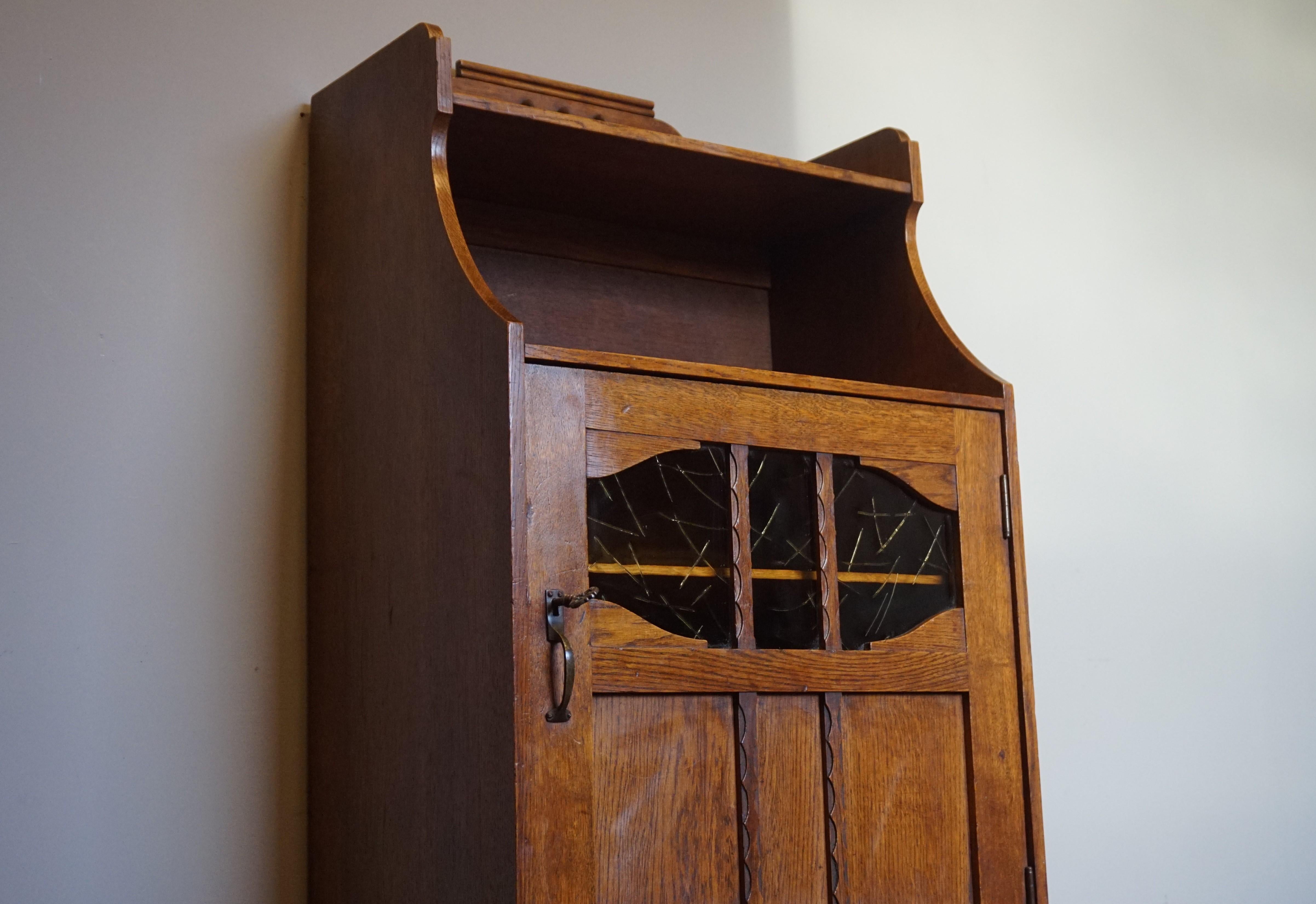 One of a kind, early 1900s small and highly practical, multi-purpose cabinet.

This stunning little Arts & Crafts cabinet showcases the beauty of early 20th century European workmanship and its good condition is like an ode to its maker. Former