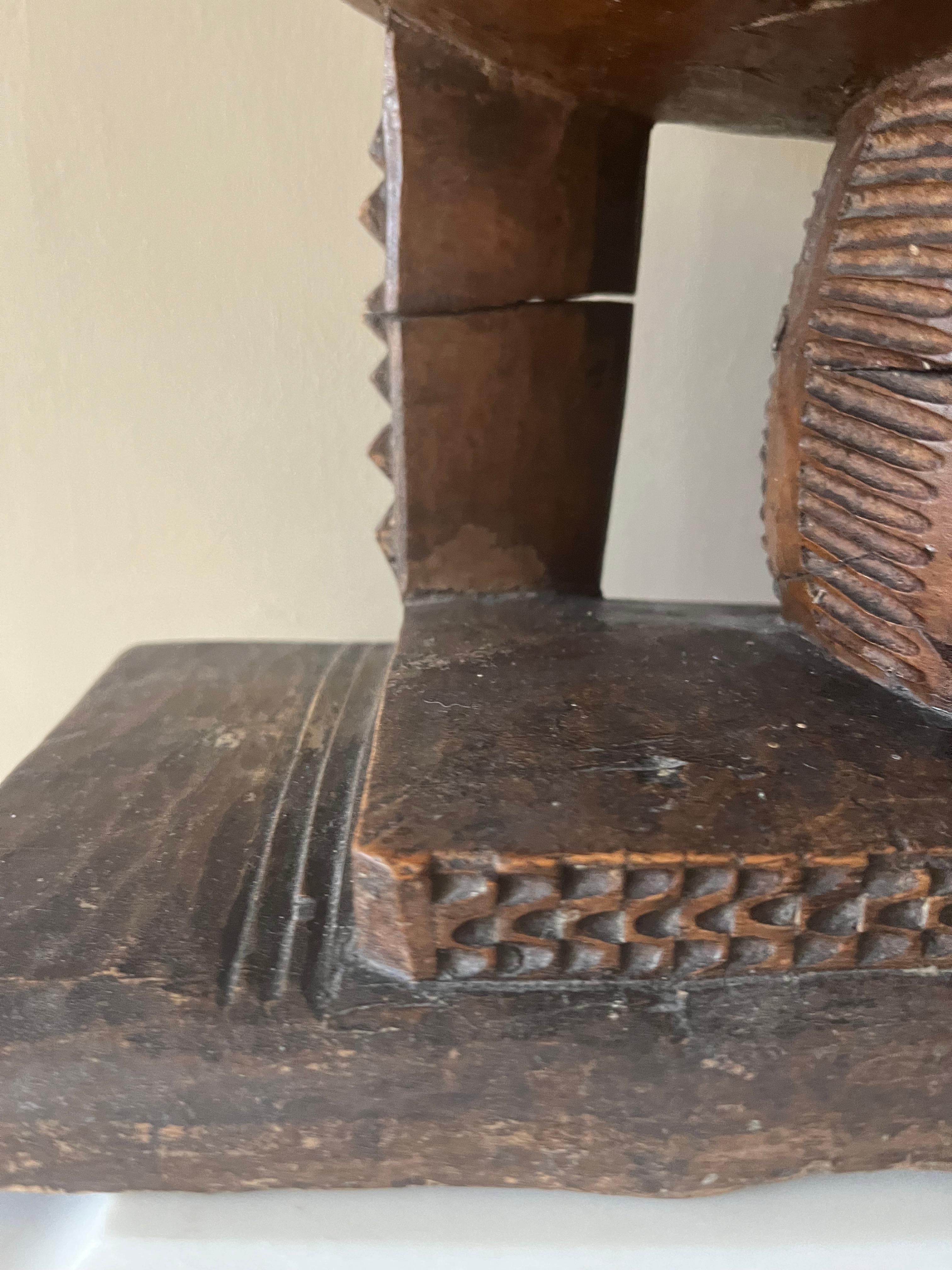 Carved Small Ashanti tribal headrest stool For Sale