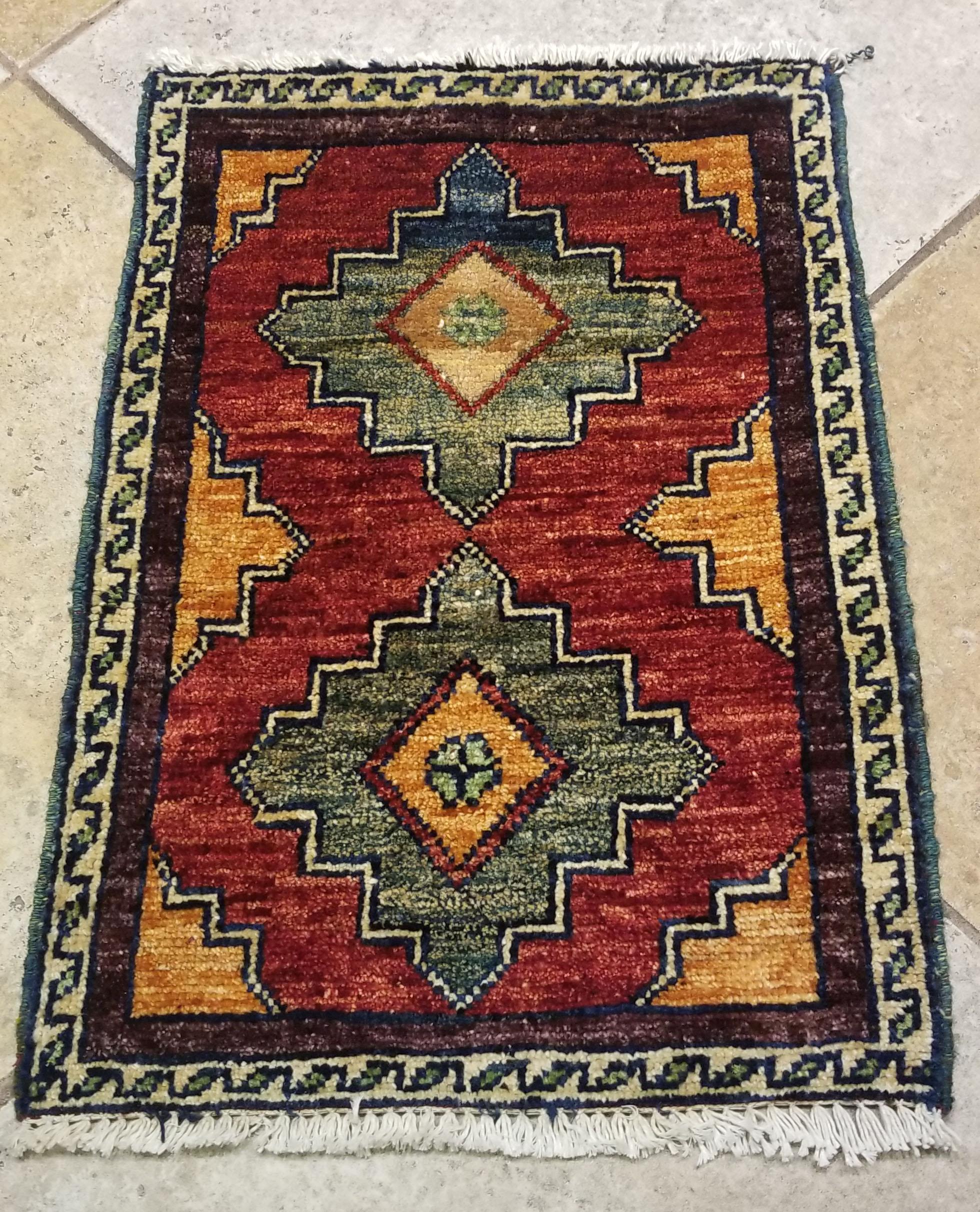 We carry some of the best Afghan bedside rugs, when you like to give your bedroom a colorful new look with one of our stunning carpets. This one measures approximately 26