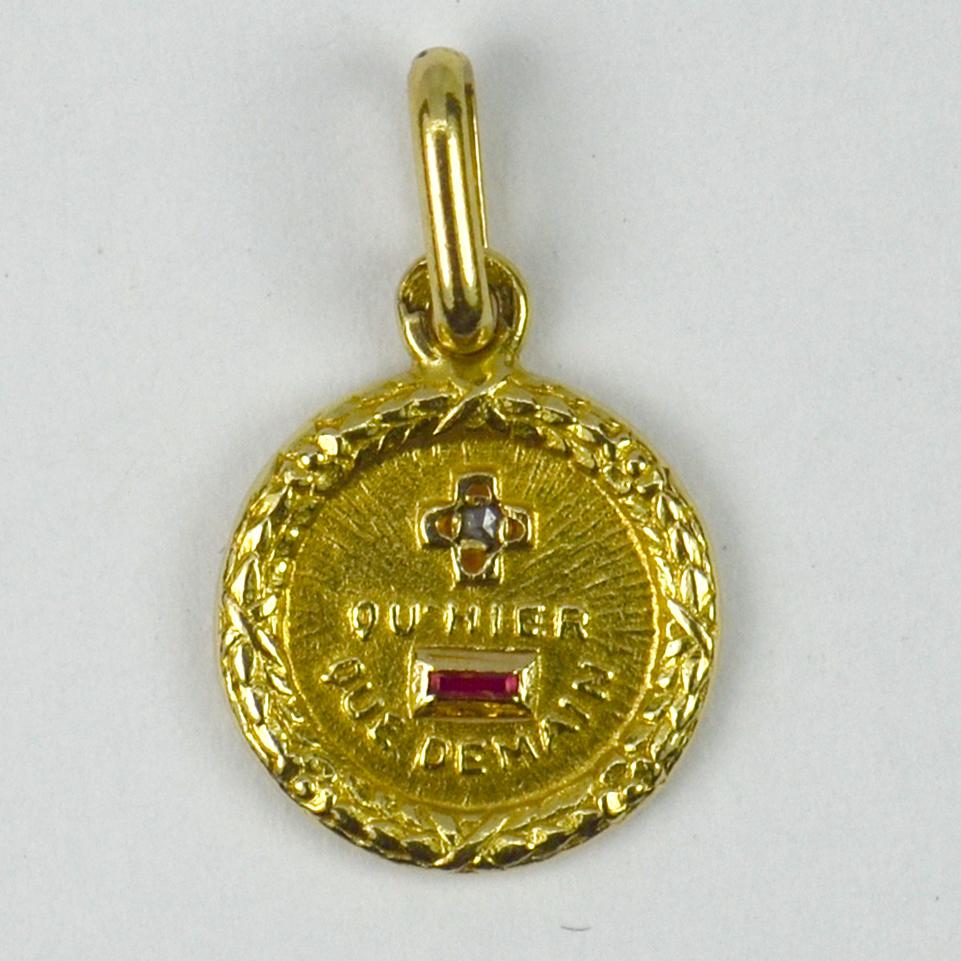 A French 18 karat yellow gold, diamond and ruby love charm pendant with a rebus spelling out 