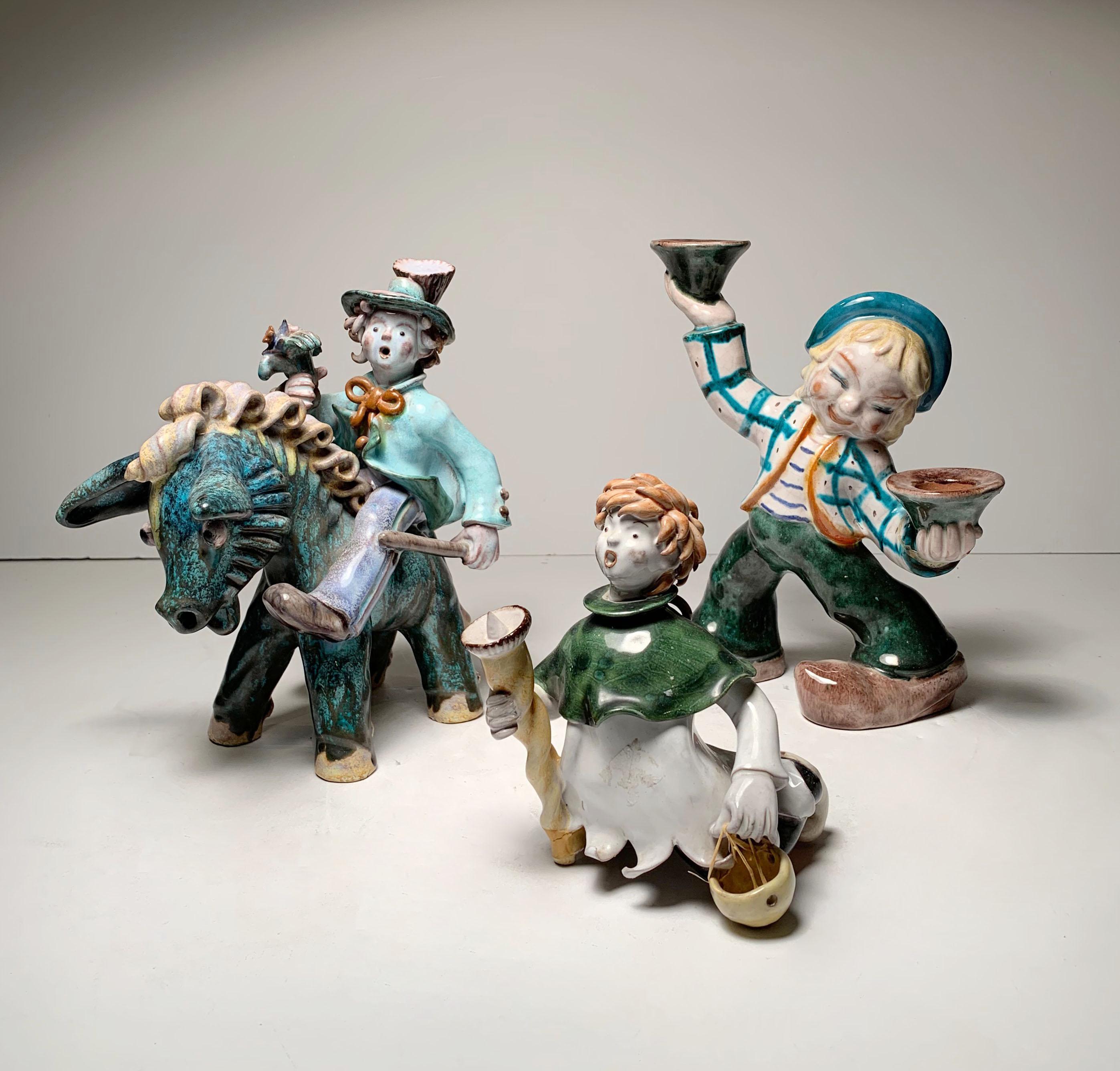 A group of 3 Austrian ceramic figures attributed to Leopold Anzengruber.

Manner of Walter Bosse and the Wiener Werkstatte

Dimension is of dancing large figure.

Note: They are all in as-is condition with damage. The little man has breaks on his