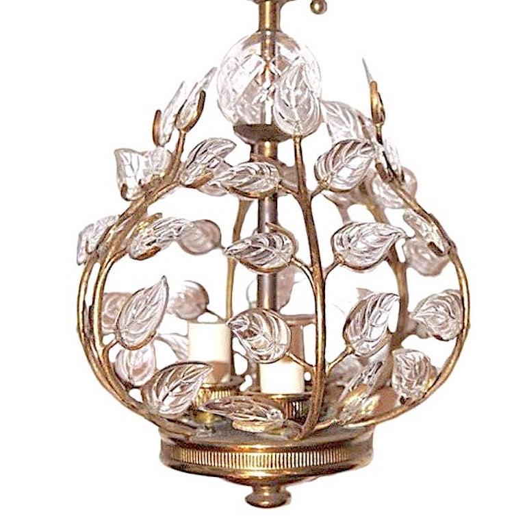 A circa 1940s French gilt metal lantern with molded glass leaves, original gilt finish, 
Three interior lights.

Measurements:
12