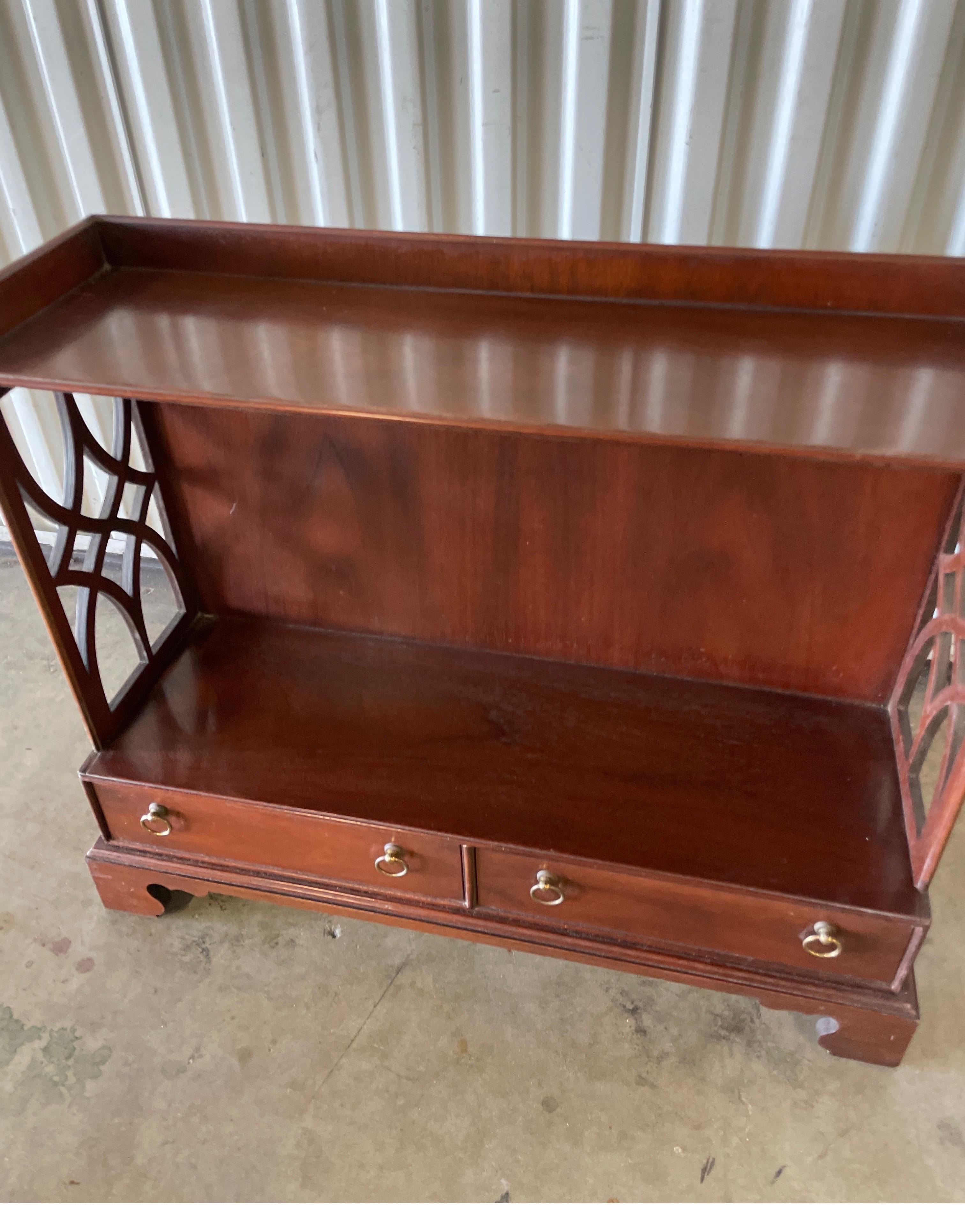 Vintage Chippendale style whatnot by Baker Furniture company. Fretwork sides and two drawers.