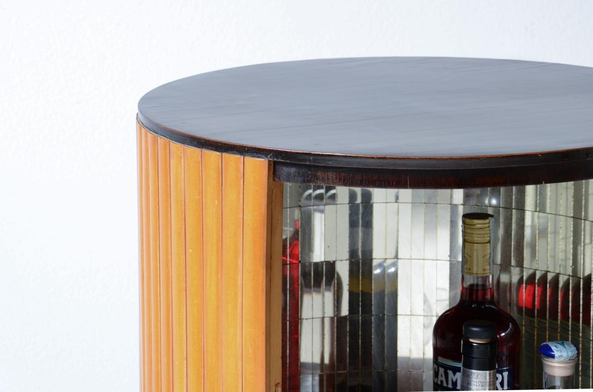 Italian Small bar cabinet in the shape of a column in blond wood