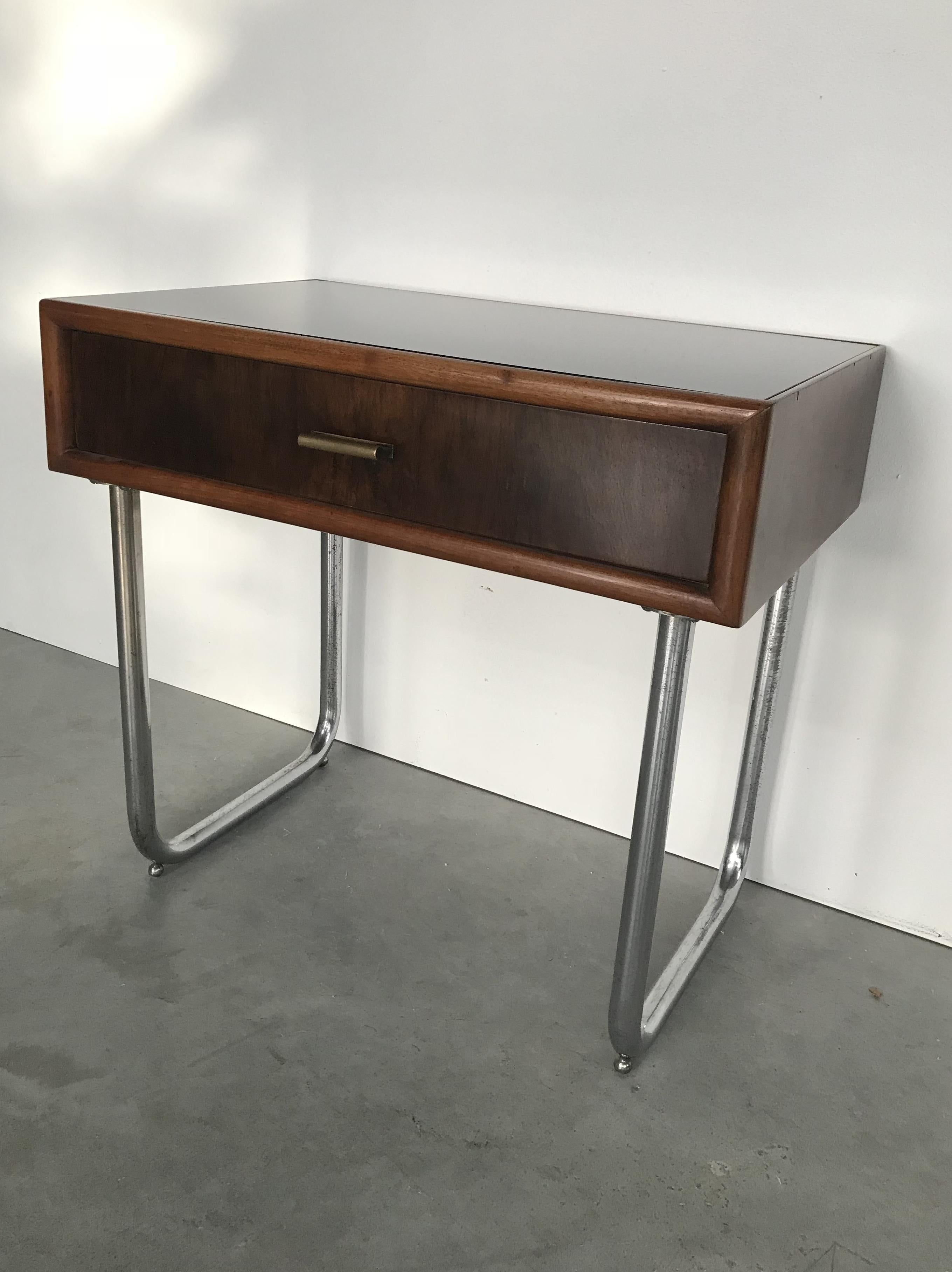 Nice Bauhaus small table with drawer. Nickel-plated legs with polished original nickel. Restored walnut wood with French-polish and original black opaline glass top.