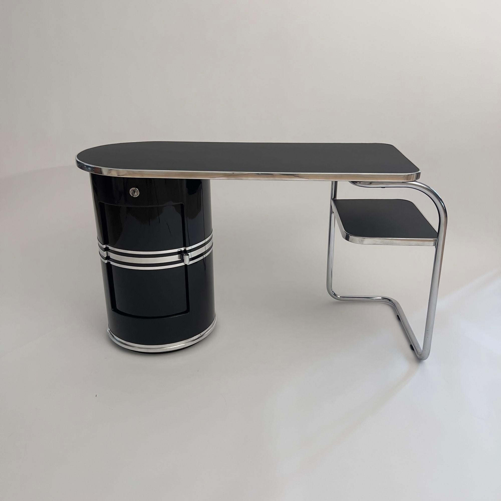 Small Mauser 'Typewriters' Desk with stool, Black Lacquer, Tubular Steel, Germany, 1954

Original, fully restored Mauser 'Rundform' desk ‚Model Frankfurt’ from Waldeck/Germany, 1954.
Manufacturer: Mauser-Werke GmbH, Waldeck
Sheet metal in high-gloss