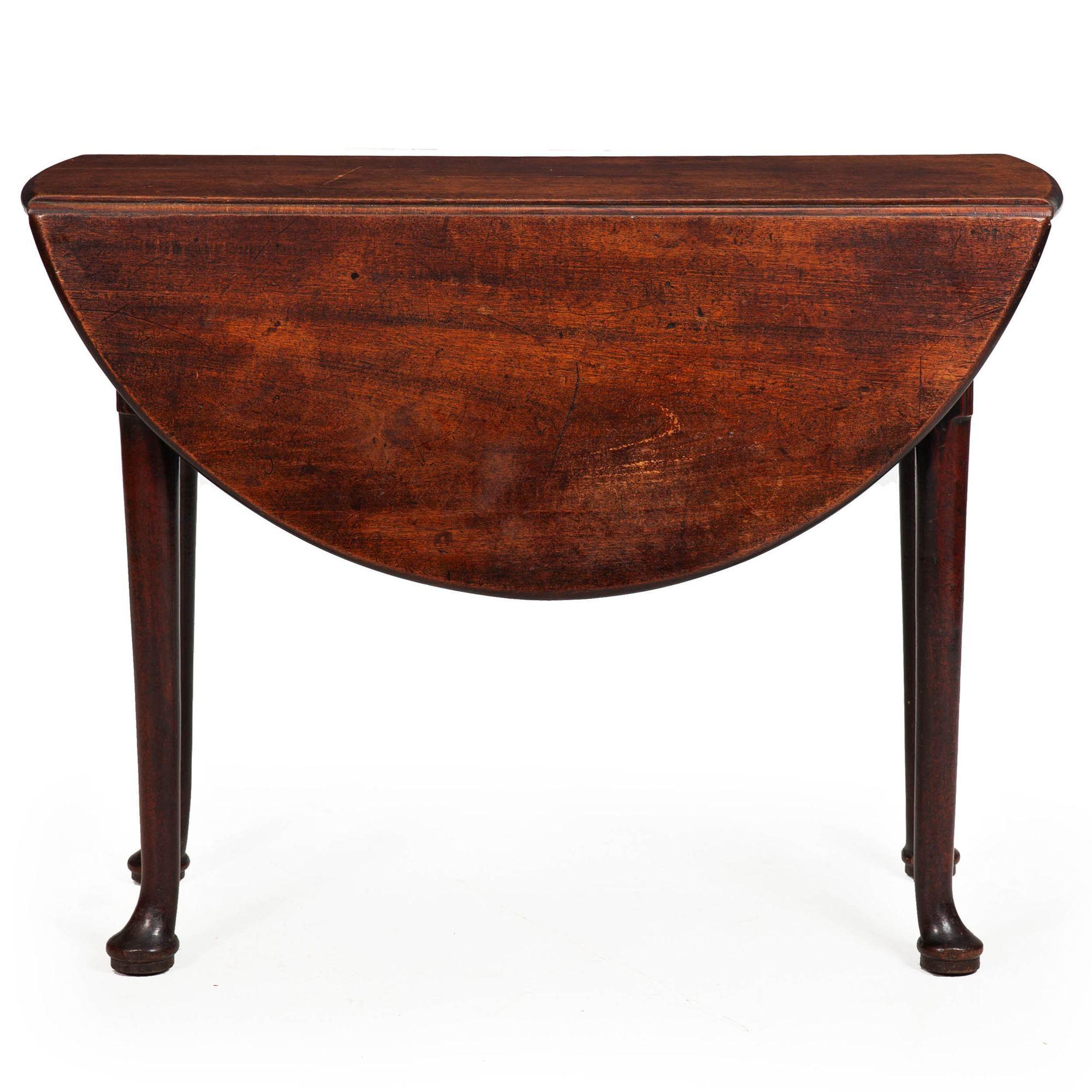 GEORGE II WALNUT DROP-LEAF TABLE
England, ca. 1750
Item # 402GKT08P

The rich patina was the first thing that caught our attention with this table - the very old historic surface is so nuanced and lovely with centuries of wear preserved in the dense
