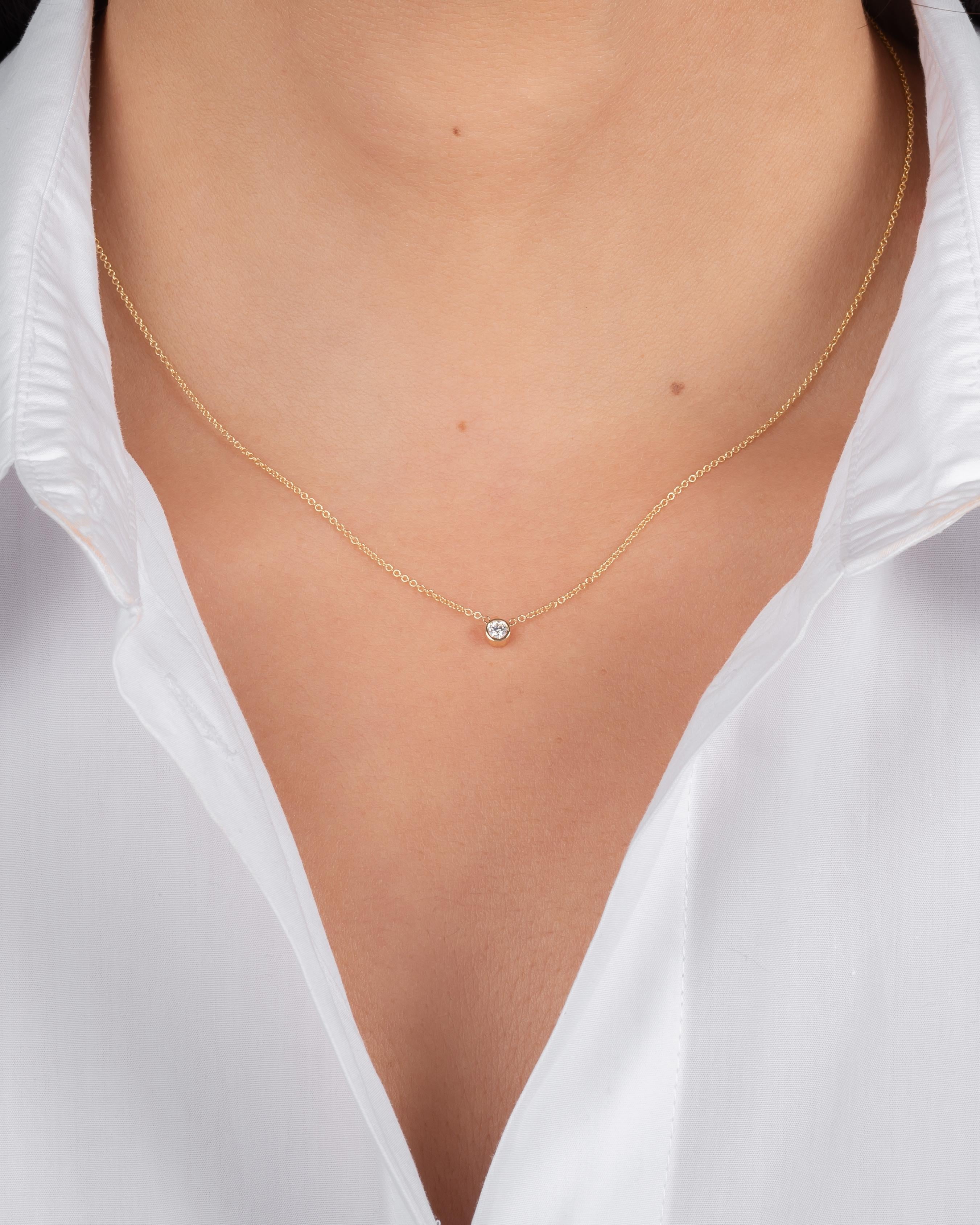 Beautifully handcrafted round single diamond in a 14k solid gold small bezel cup hanging from a dainty cable link chain. Chic and timeless, wear it by itself or layered, day or night.

Made in L.A.
14k Yellow Gold
16