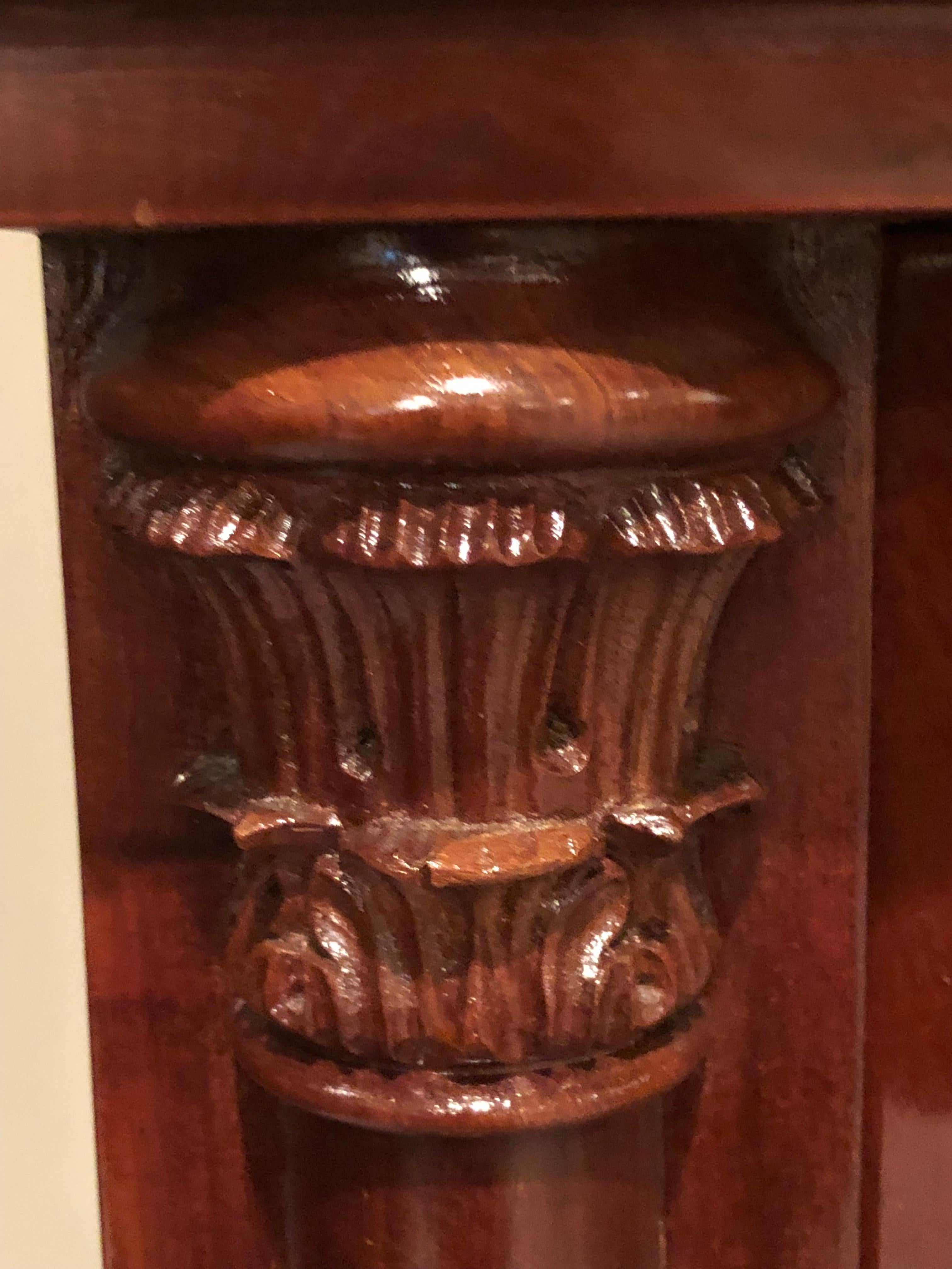 Small Biedermeier cabinet, Northern Germany or Denmark, circa 1820, mahogany veneer. Beautiful veneer grain and nicely carved details. In very good condition.