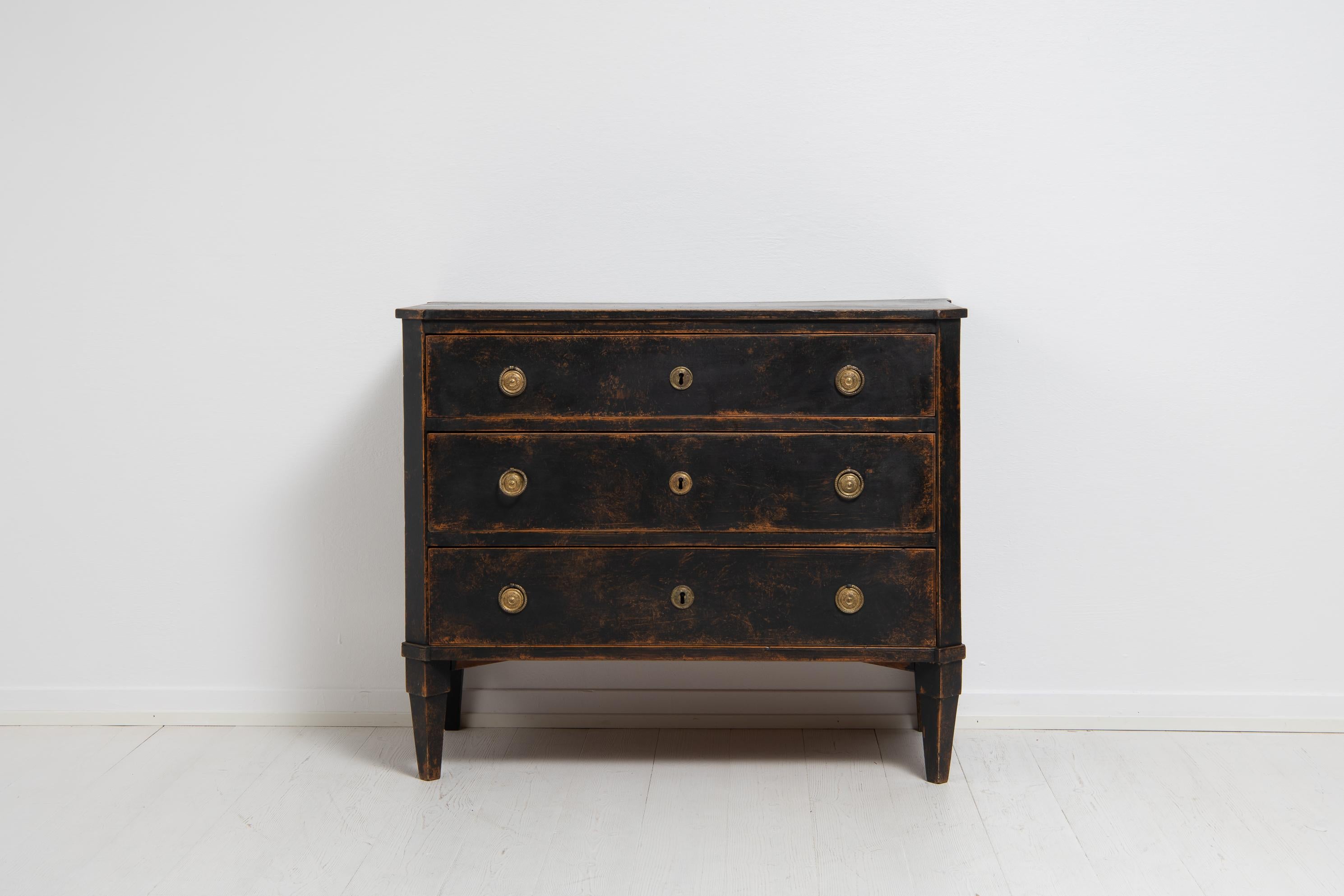 Northern Sweden Gustavian chest of drawers with black paint. The chest is from between 1790 and 1800 and made in Swedish pine. The chest has the Classic Gustavian proportions and designs with straight lines and minimal decor. Such as the slanted