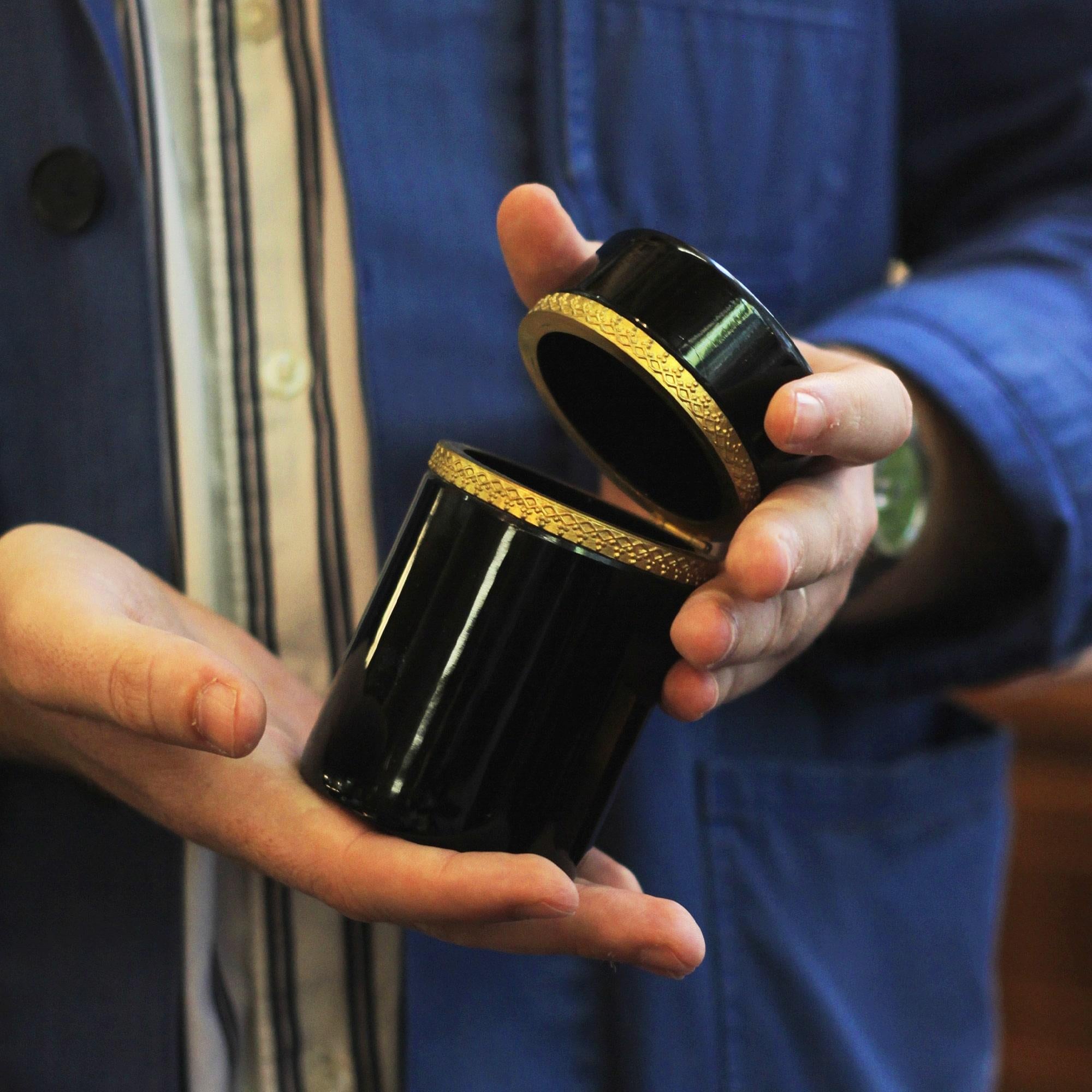 A fine black amethyst glass lidded vanity box. Attributed to Moser, the piece features gilt bronze mounts and is in lovely condition. The box dates to the Turn of the Century, circa 1900, and would have been manufactured in Bohemia (modern day Czech