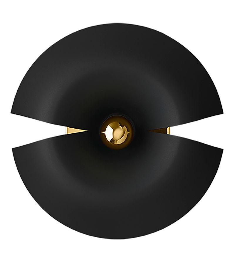 Small black and gold contemporary wall lamp 
Dimensions: Diameter 30 x H 14 cm 
Materials: Aluminum with Powder-Coated. Brass plated details, Porcelain socket, Plastic switch, and Black textile cord. 
Details: For all lamps the light source is E27