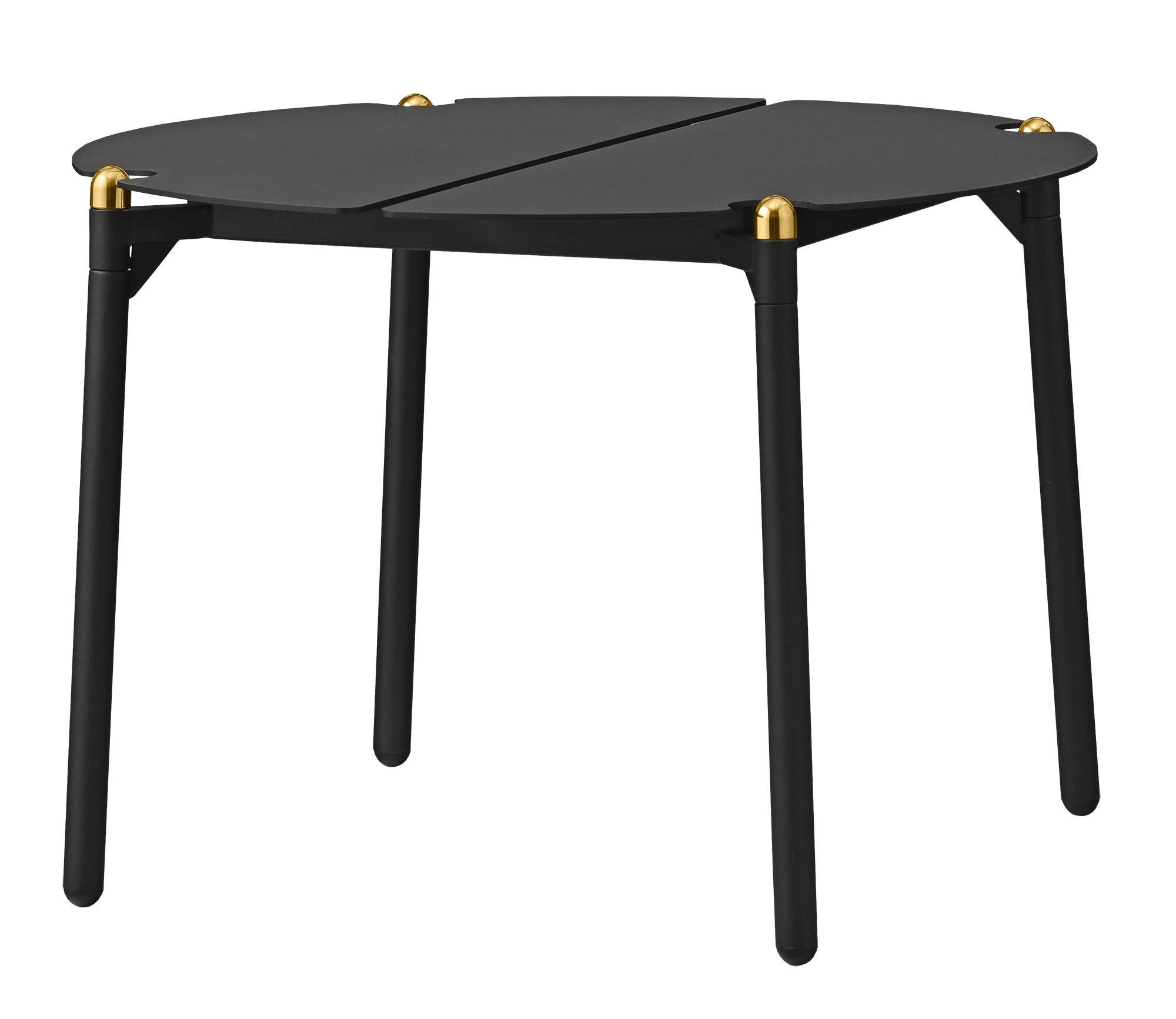 Small Black and Gold Minimalist lounge table
Dimensions: Diameter 50 x H 35 cm 
Materials: Steel w. Matte Powder Coating, Aluminum w. Matte Powder Coating & Stainless Steel w. Gold Titanium Plating.
Available in colors: Taupe, Bordeaux, Forest,