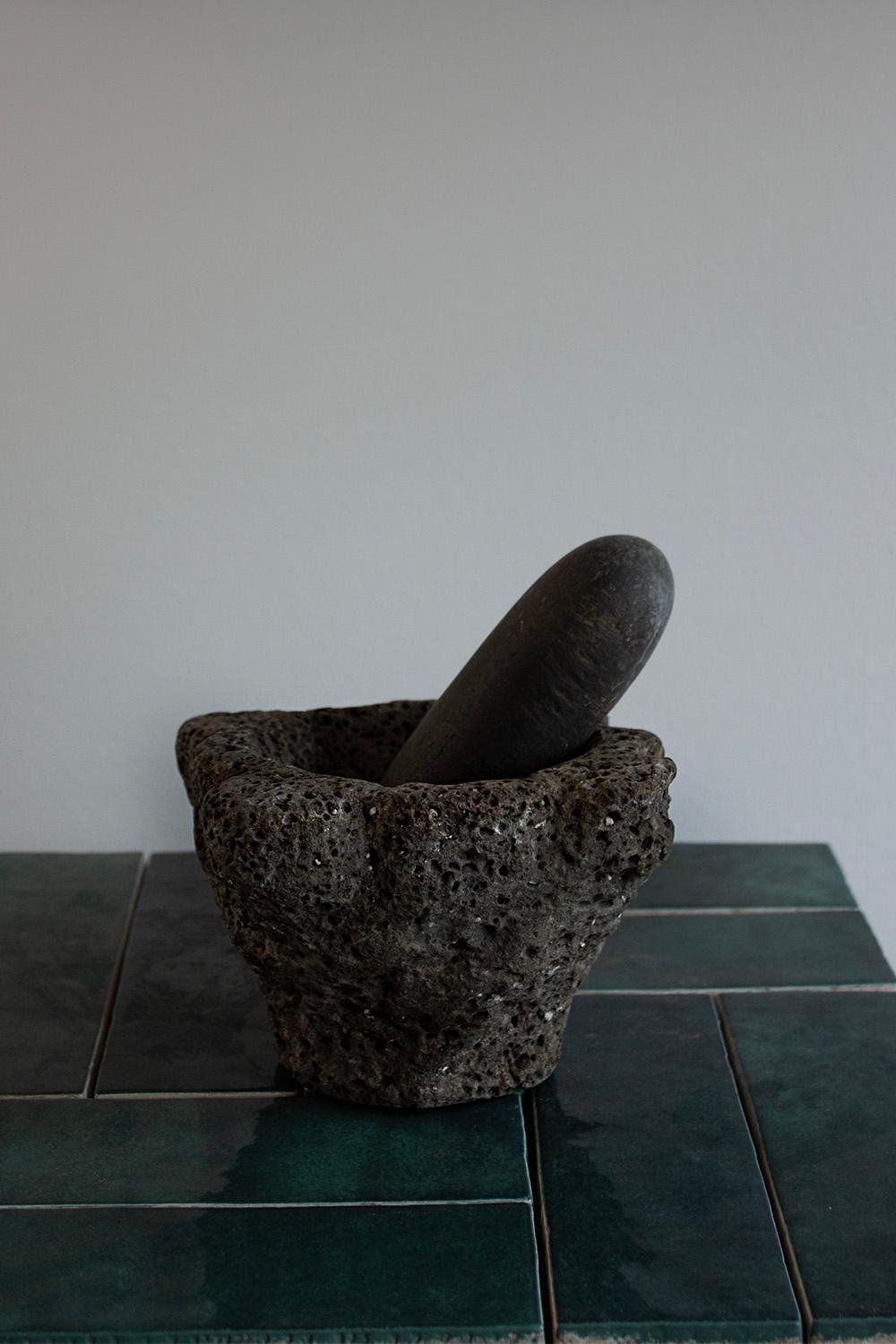 This small French mortar was sourced in the south of France. It's an iconic and traditional kitchen object which is found all over France. Its traditional use was and still is to grind seeds and herbs. 
This kitchen mortar will instantly add a touch