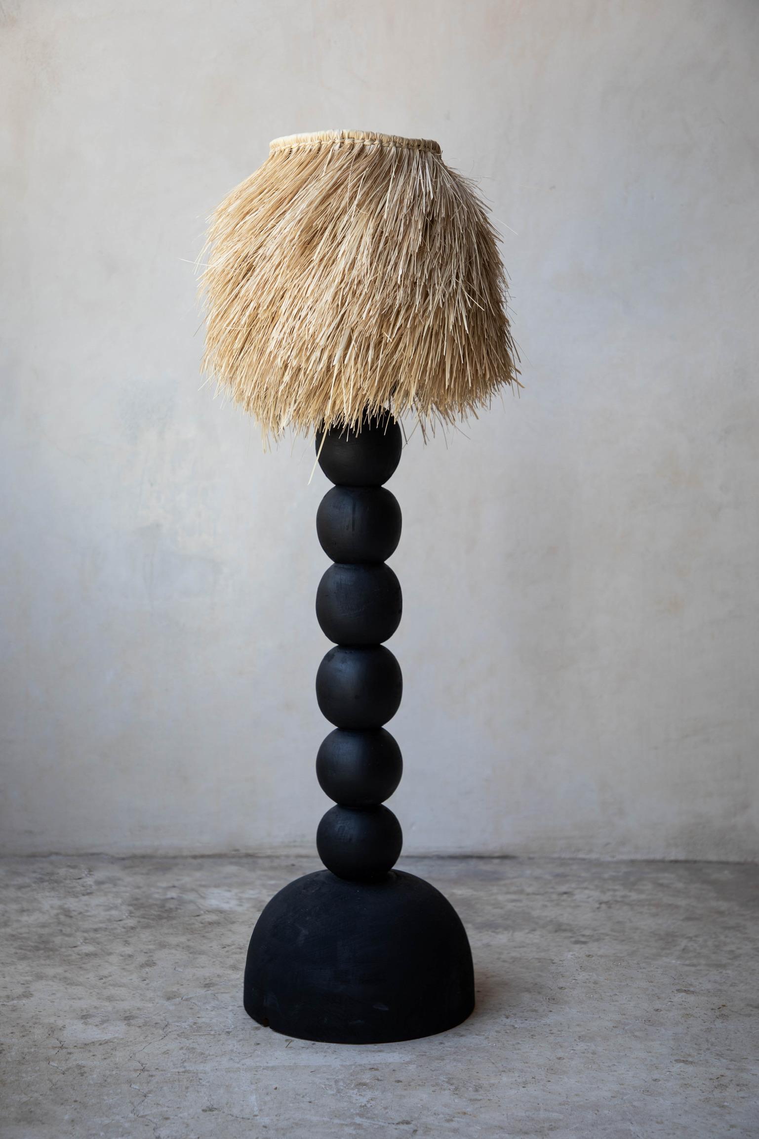 Small black jabin wood floor lamp with palm screen by Daniel Orozco
Material: Jabin wood.
Dimensions: D 30 x H 110 cm
Available in palm or linen lampshade and in natural or black wood finish.
Available in 2 sizes: D 30 x H 110, D 40 x H 160