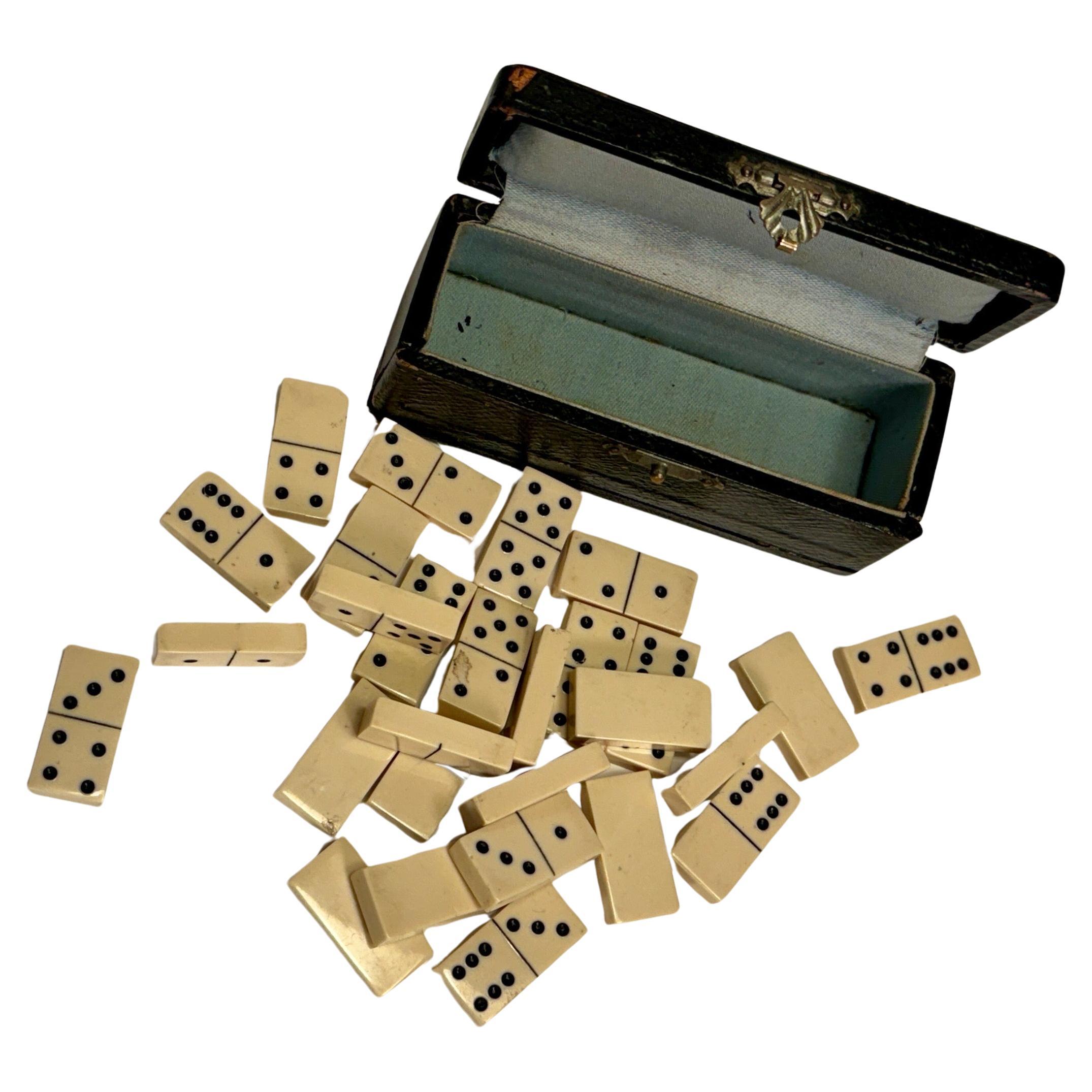 Small 28 Pieces Dominos Travel Size Board Game in Small Black Leather Incased Box.
Each piece measures 1.1 by 0.6 by 0.2 inches.