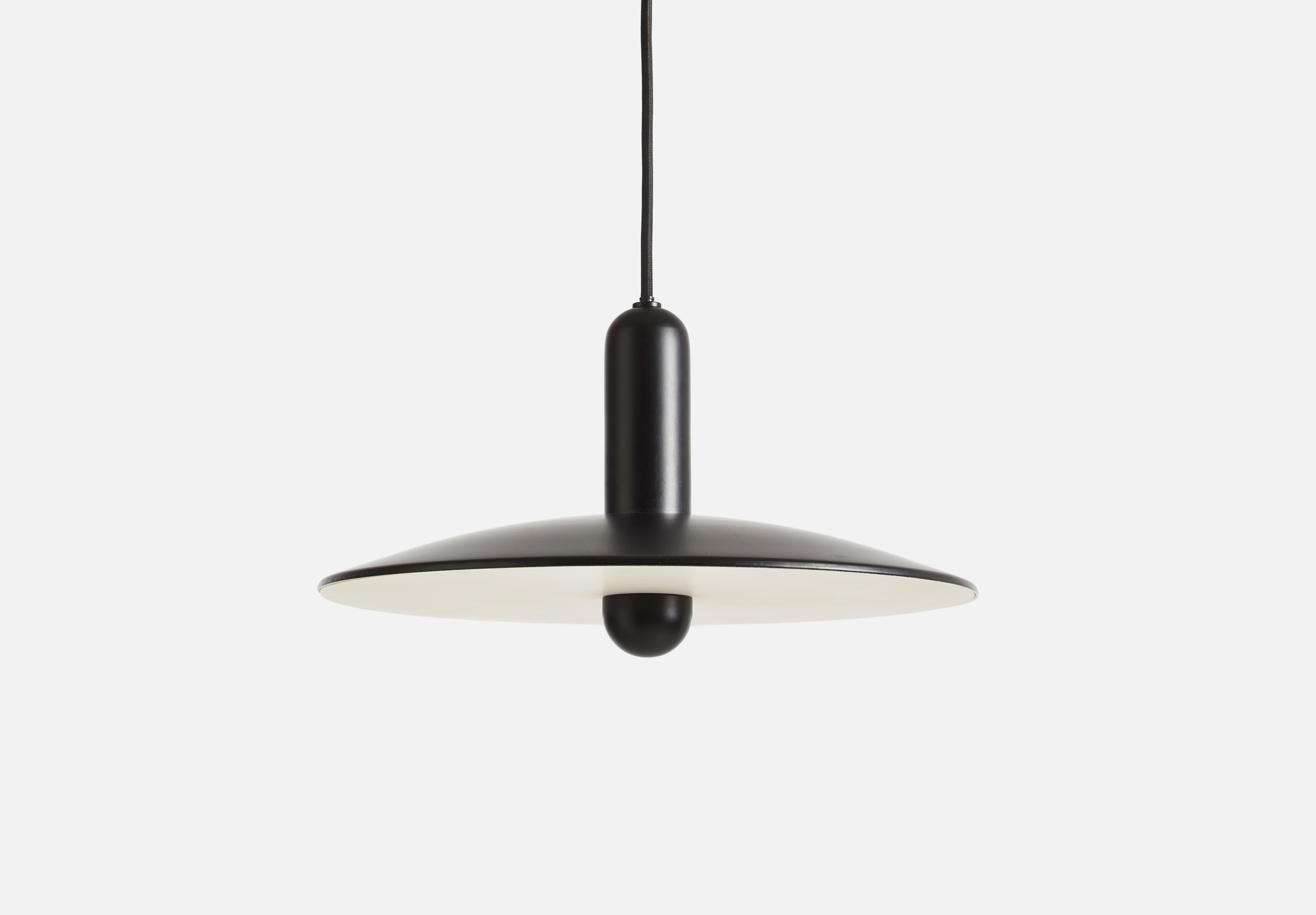 Small black Lu pendant lamp by Beaverhausen
Materials: Metal.
Dimensions: D 33 x H 22 cm
Available in black or taupe and in 2 sizes: D 33, D 45 cm.

Beaverhausen is a Brussels-based design studio founded by Mimy A. Diar and Ad Luijten. Both