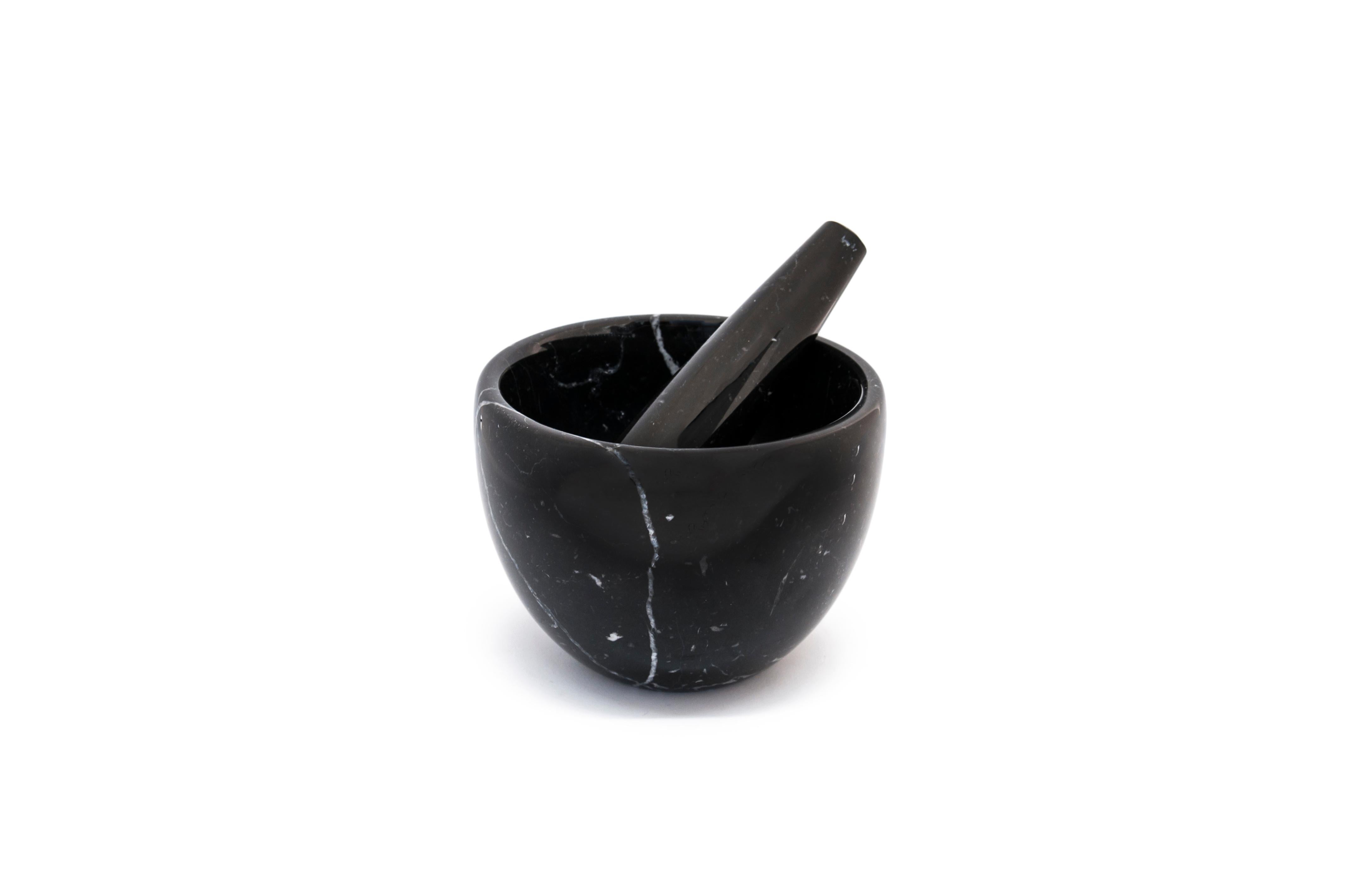 Small black Marquina marble mortar and pestle. 

Size of the mortar: diameter 12 cm x height 9; size pf the pestle: diameter 3.5 cm x 12.5 cm length.

The product cannot be washed in dishwasher but needs to be cleaned with water or Marseille