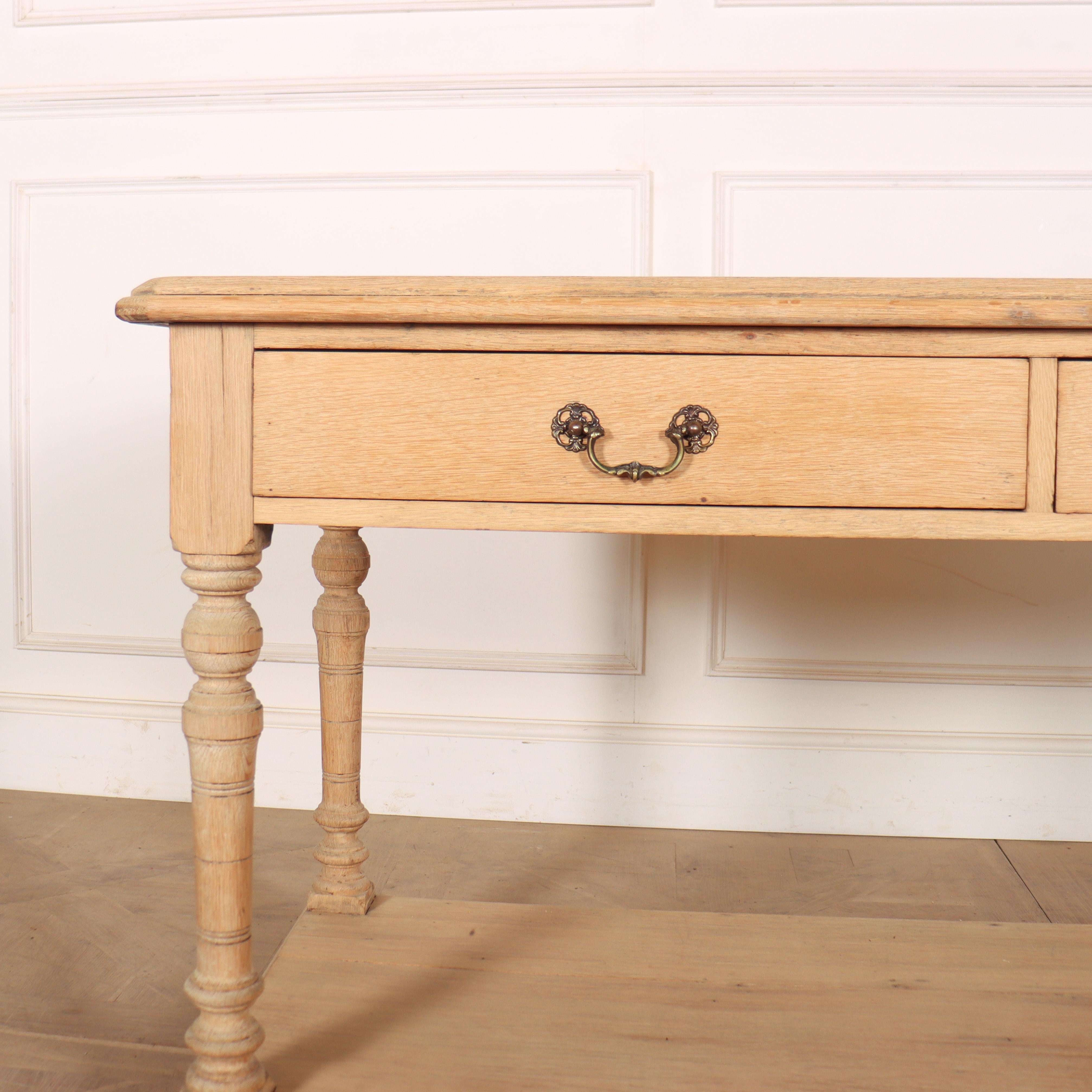 Small 19th century English two drawer bleached oak drapers table. 1890.
Internal reference: H.

Code: 8588

Dimensions:
W: 54.5