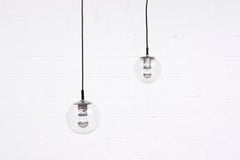 Small Hand Blown Glass Globe Pendants by RAAK with Chrome Hardware