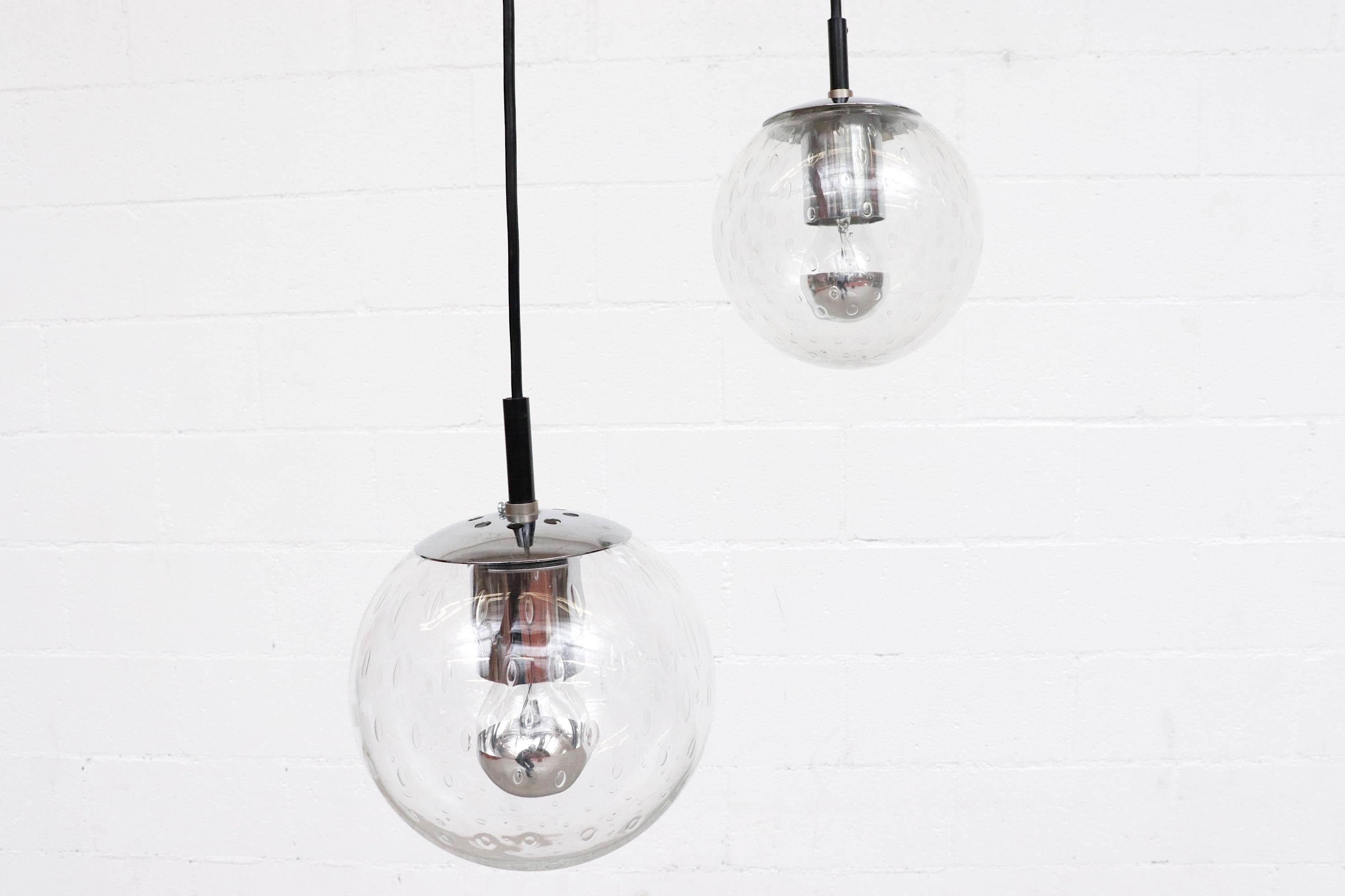 Mid-Century Modern Small Hand Blown Glass Globe Pendants by RAAK with Chrome Hardware For Sale