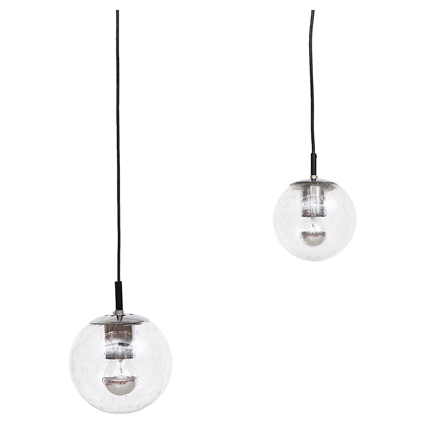 Small Hand Blown Glass Globe Pendants by RAAK with Chrome Hardware