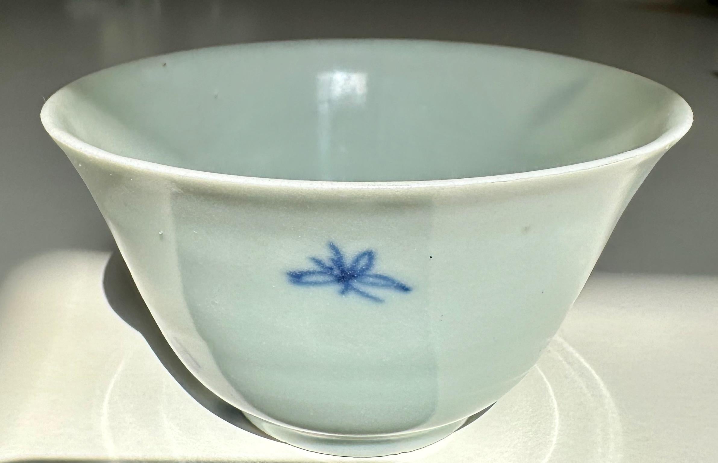 17th Century blue and white bowl from Hatcher Cargo with the exterior freely painted with two stylised flowering orchid plants and a dragonfly. Chenghua six-character mark. 

This bowl was part of a hoard recovered by Captain Michael Hatcher from