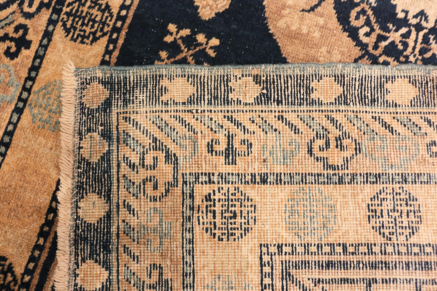 Hand-Knotted Small Blue Background Antique Khotan Rug