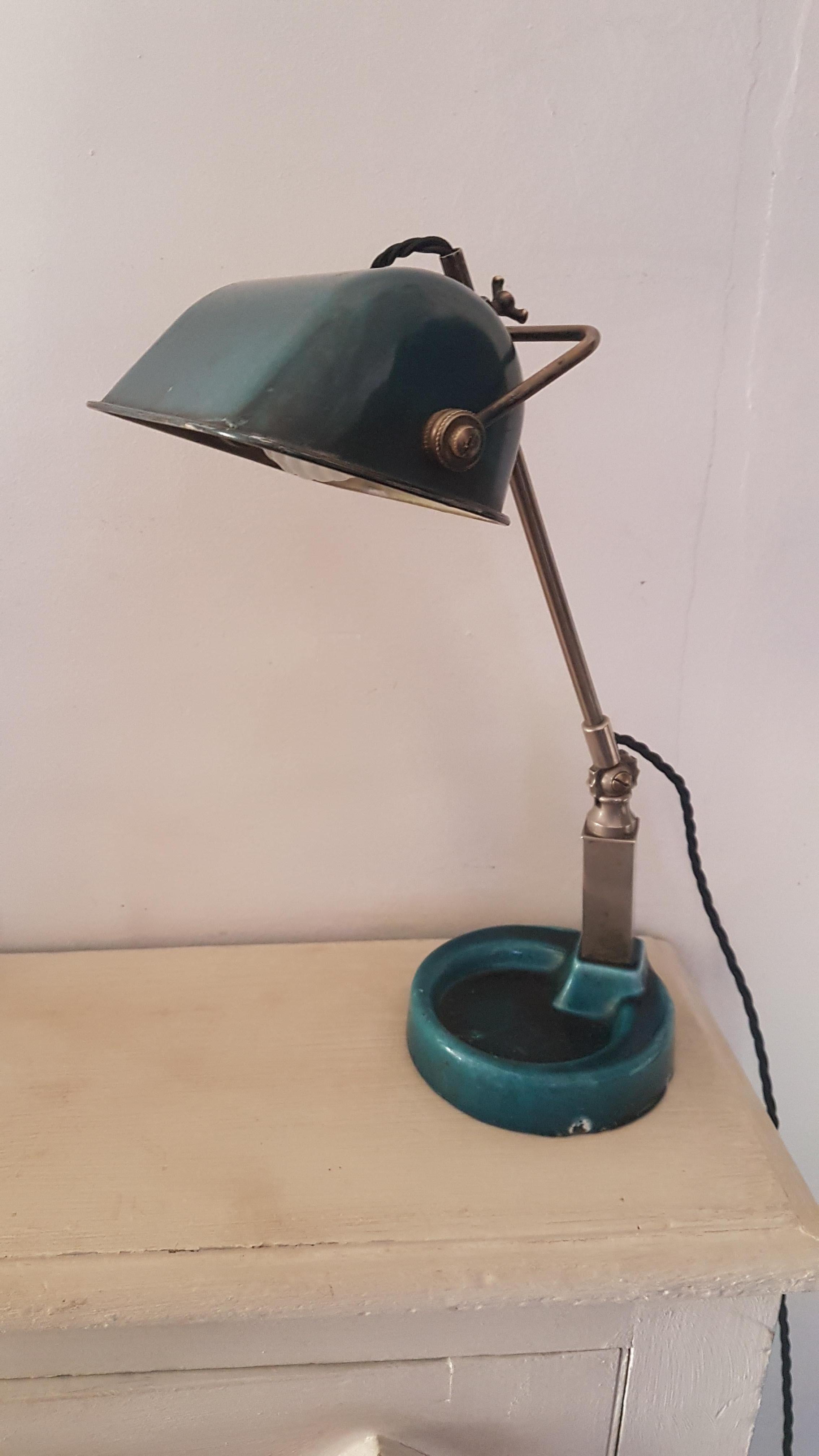 A beautiful blue enameled bankers lamp, the base is enameled on cast iron whilst the shade is on metal. The shade is adjustable in height using the nut, the angle is adjustable as well. The column is chromed and in good condition. Has been fully