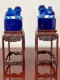 Small Blue Glass Foo Dogs on a Base, a Pair