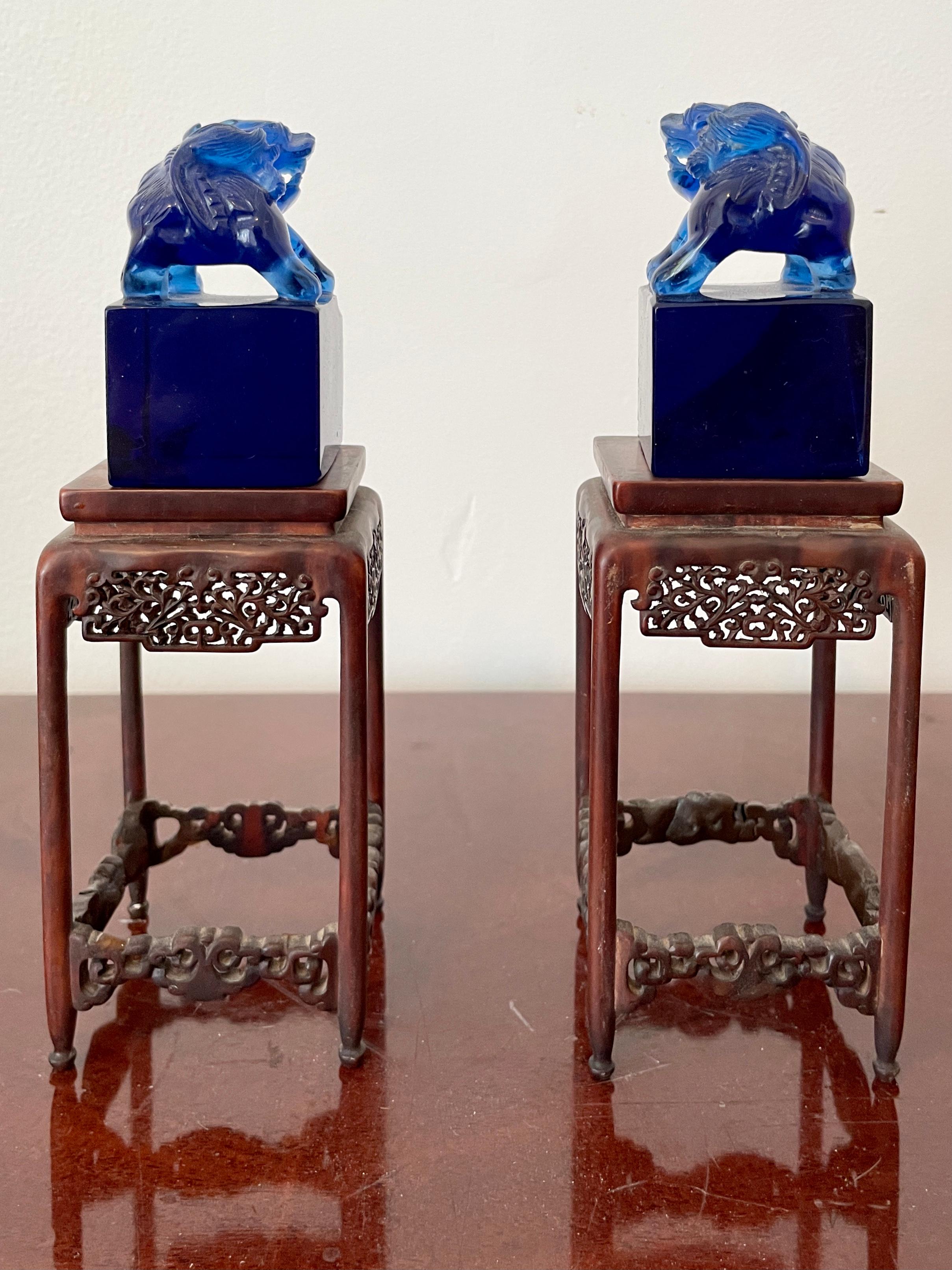 Small Blue Glass Foo Dogs on a Base, a Pair In Good Condition For Sale In Los Angeles, CA
