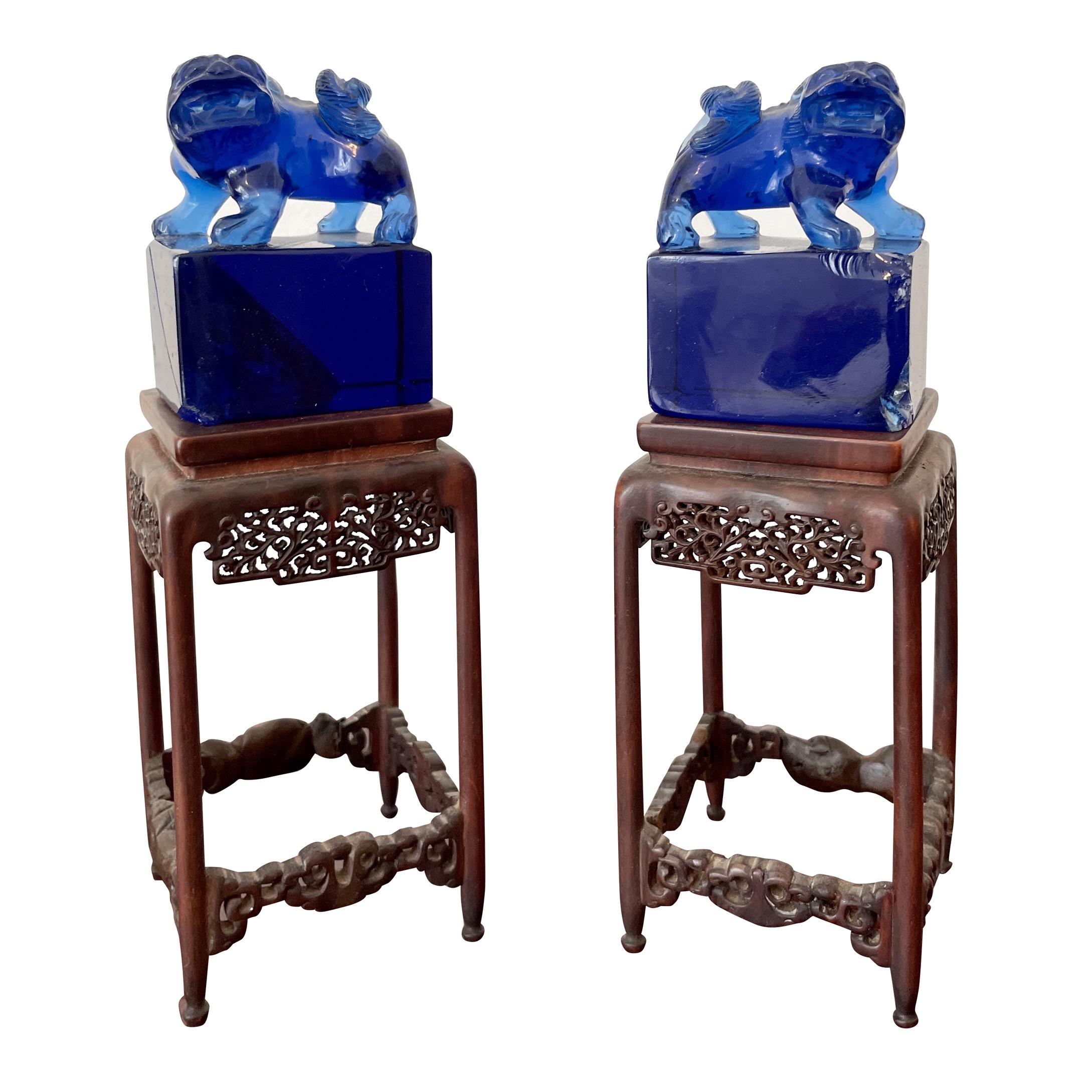 Small Blue Glass Foo Dogs on a Base, a Pair