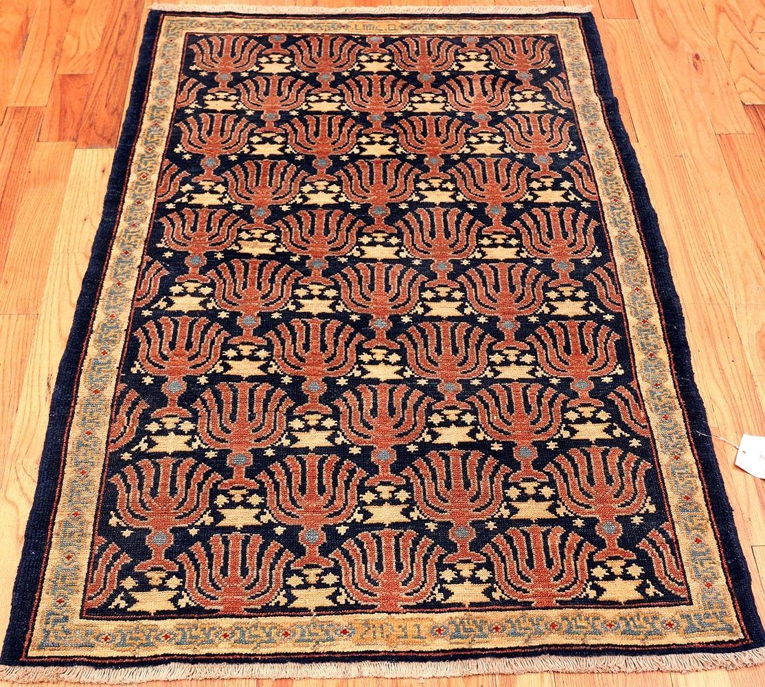 A highly artistic Menorah Judaica motif small size blue color background antique Israeli Bezalel rug, country of origin / Rug type: Israeli rugs, circa date: 1920. Size: 3 ft 6 in x 4 ft 10 in (1.07 m x 1.47 m)