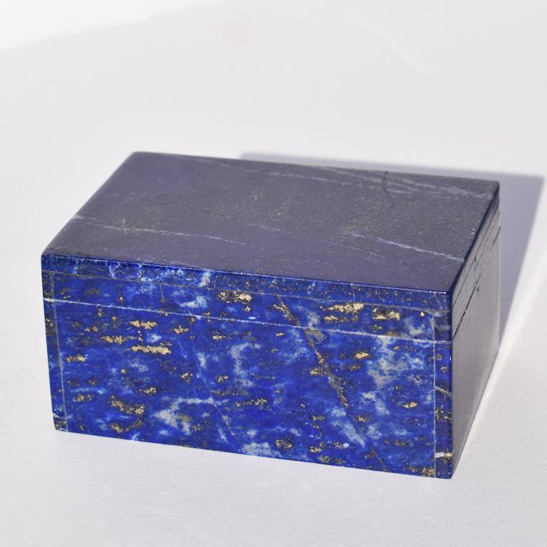 Beautiful blue Lapis Lazuli and Carrara marble stone jewelry box. Created from genuine blue Lapis Lazuli, this box is low in profile and rectangular in form. This lovely jewelry or trinket box features a lid that fits onto its base. Both of which