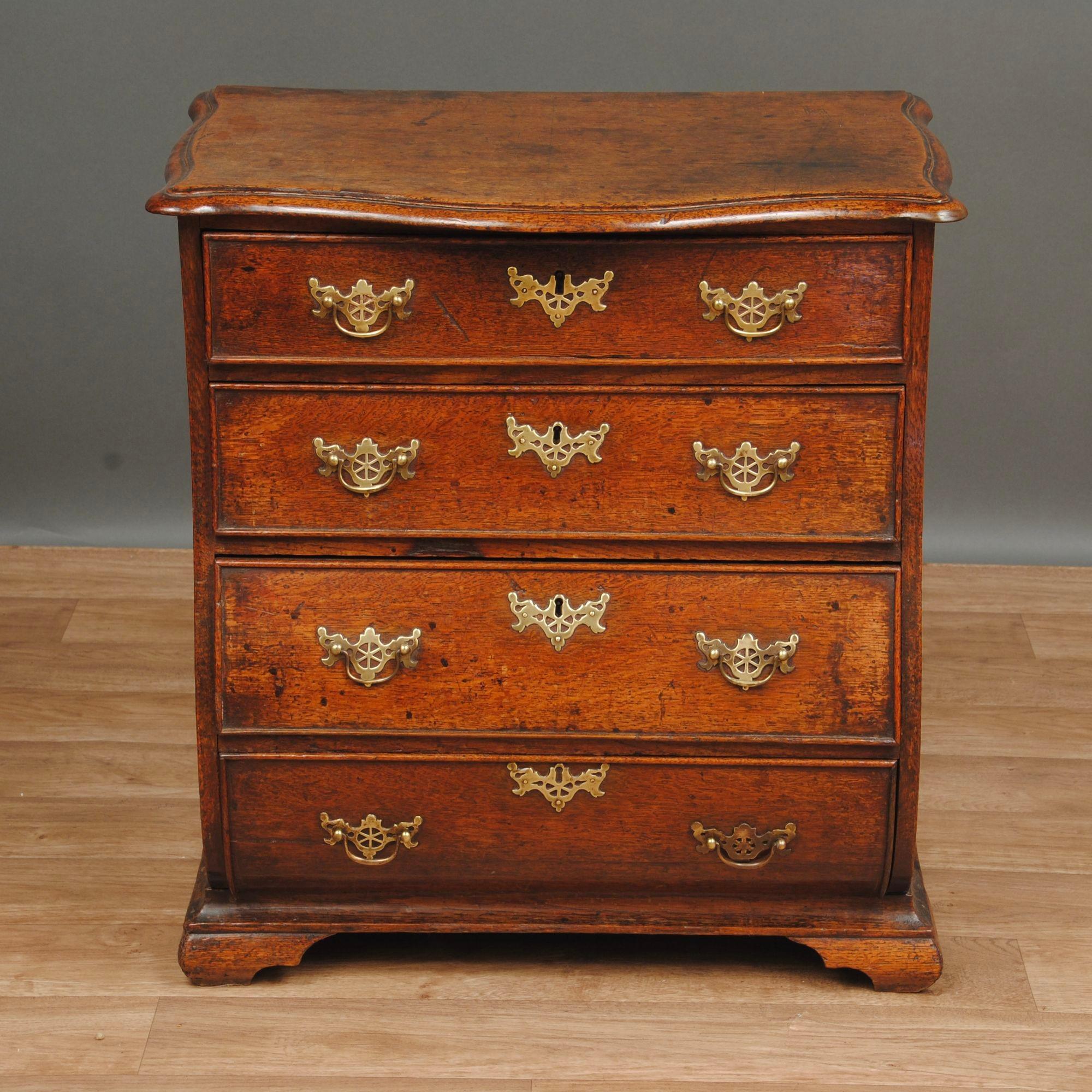 A small 18th century oak bombe fronted chest with the original brass handles, likely to be made in Norfolk by a dutch cabinet maker.
Good original colour and patination, circa 1780.
